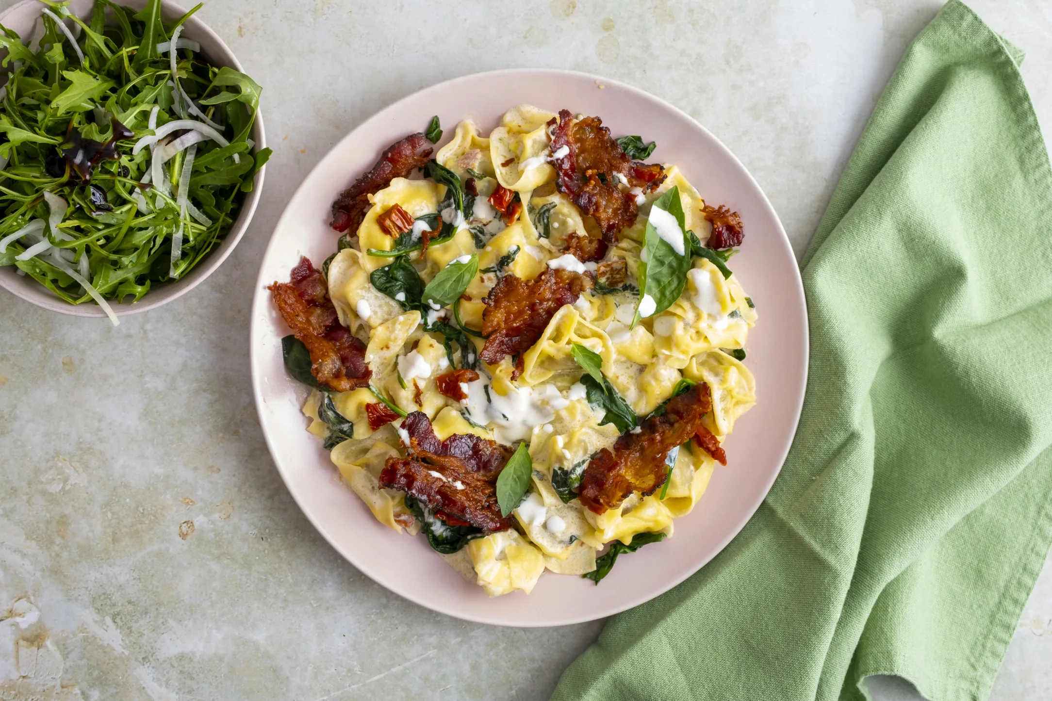 Porcini Mushroom Tortellini and Crispy Bacon in Alfredo Sauce with Balsamic Rocket Salad