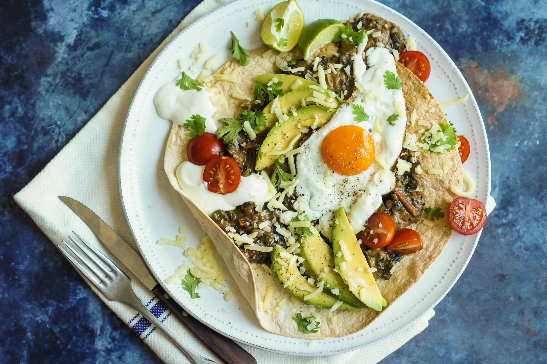 Huevos Rancheros with Beans, Avocado and Crispy Tortilla