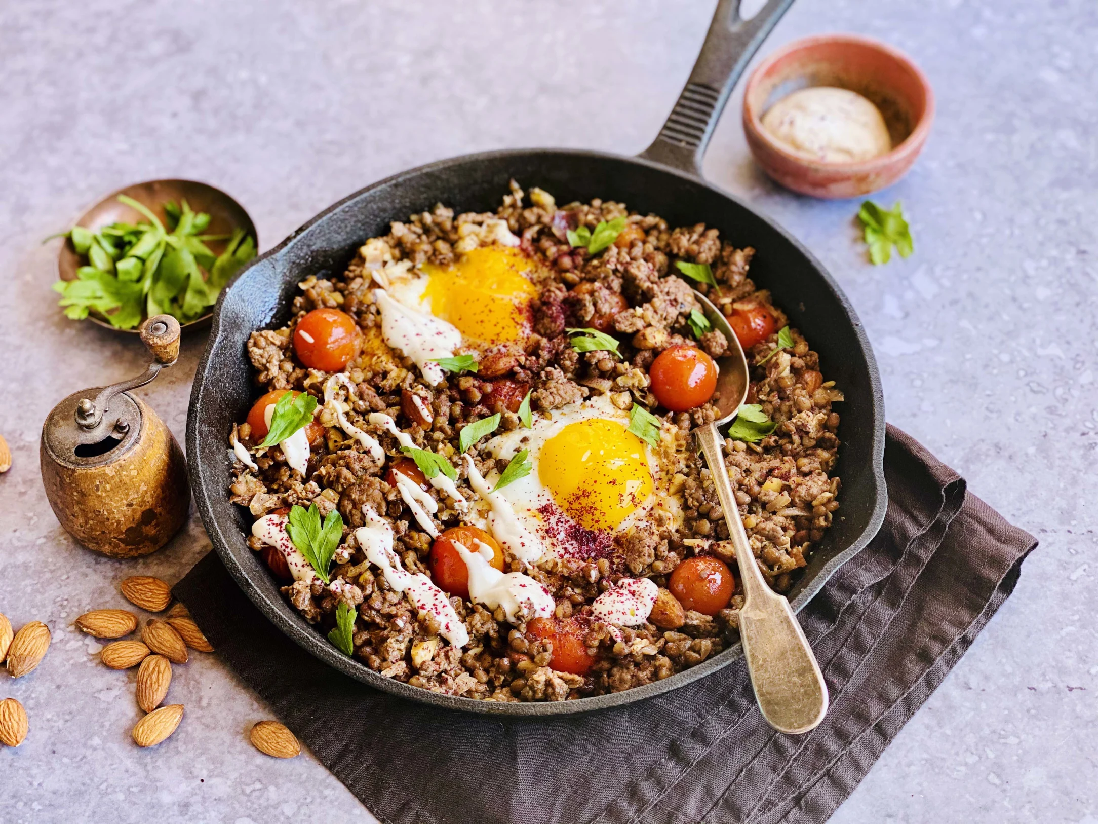 Braised Eggs in Levantine Lamb and Lentil Stew with Tahini