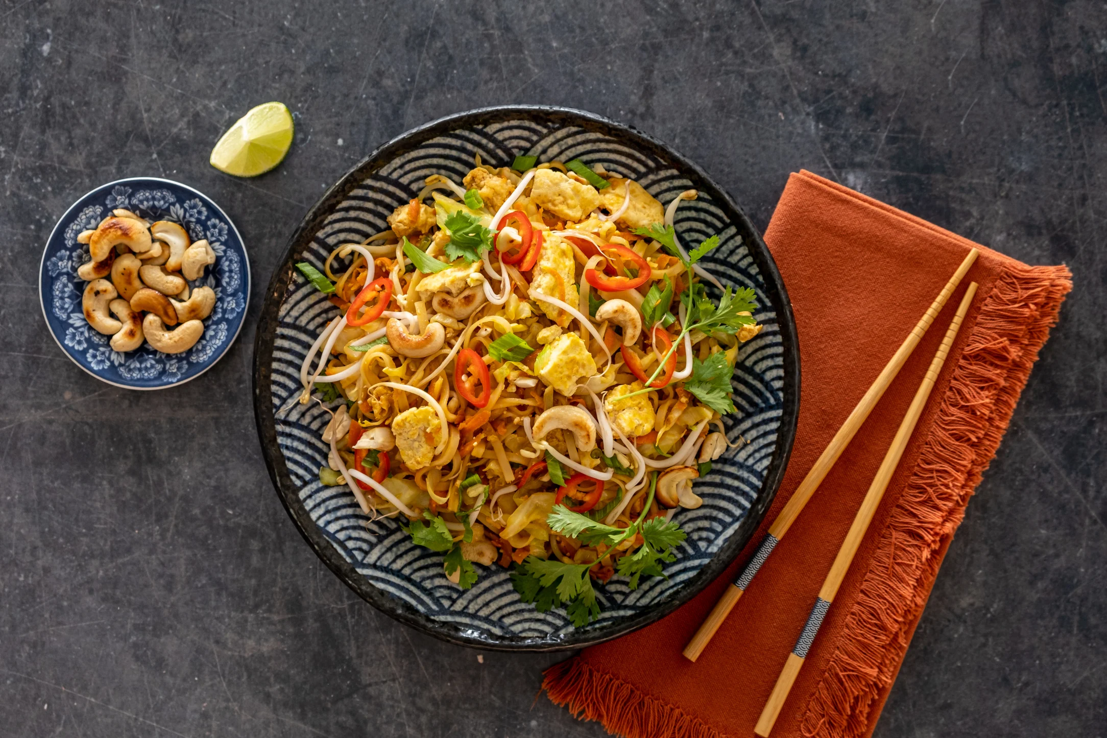 Vegan Tofu and Rice Noodle Stir-fry with Cabbage, Carrots, and Cashew Nuts
