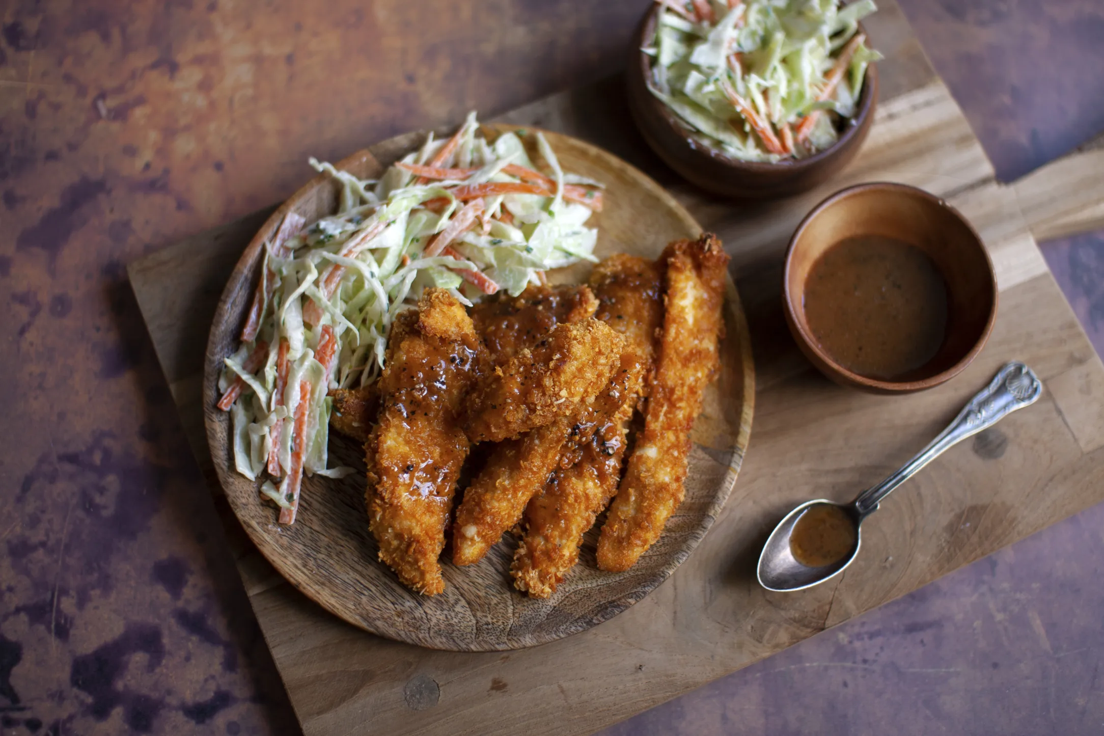 Baked Buffalo Chicken Tenders with Ranch Coleslaw and Roast Potatoes