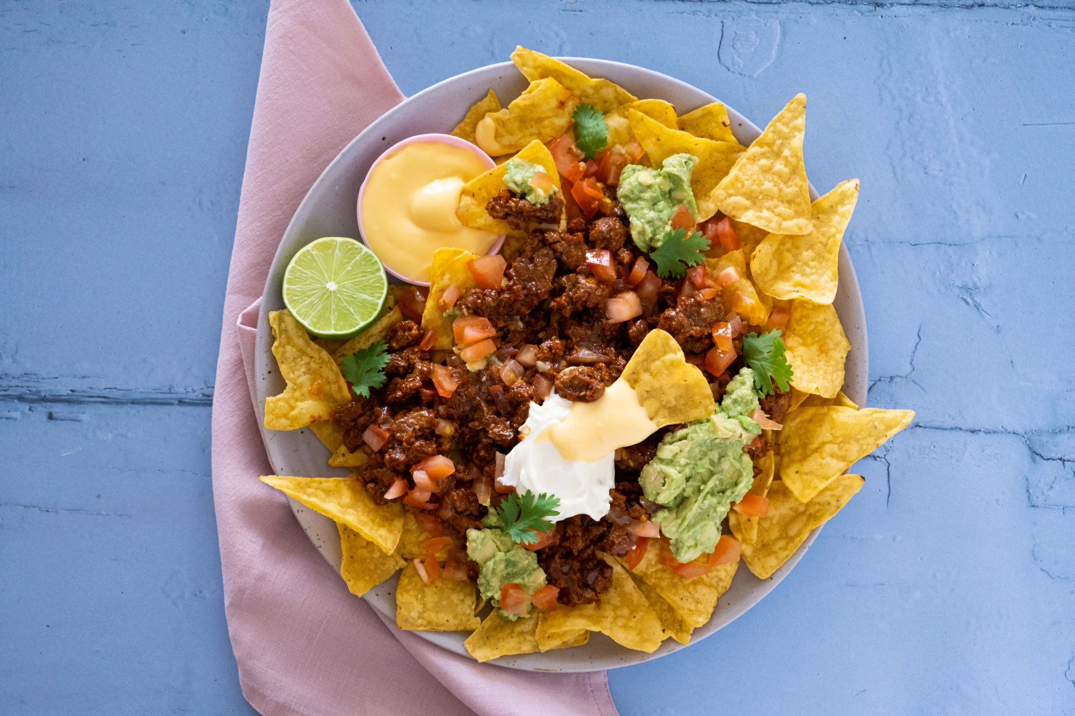 Loaded Beef Nachos with Cheddar Cheese Sauce and Avocado