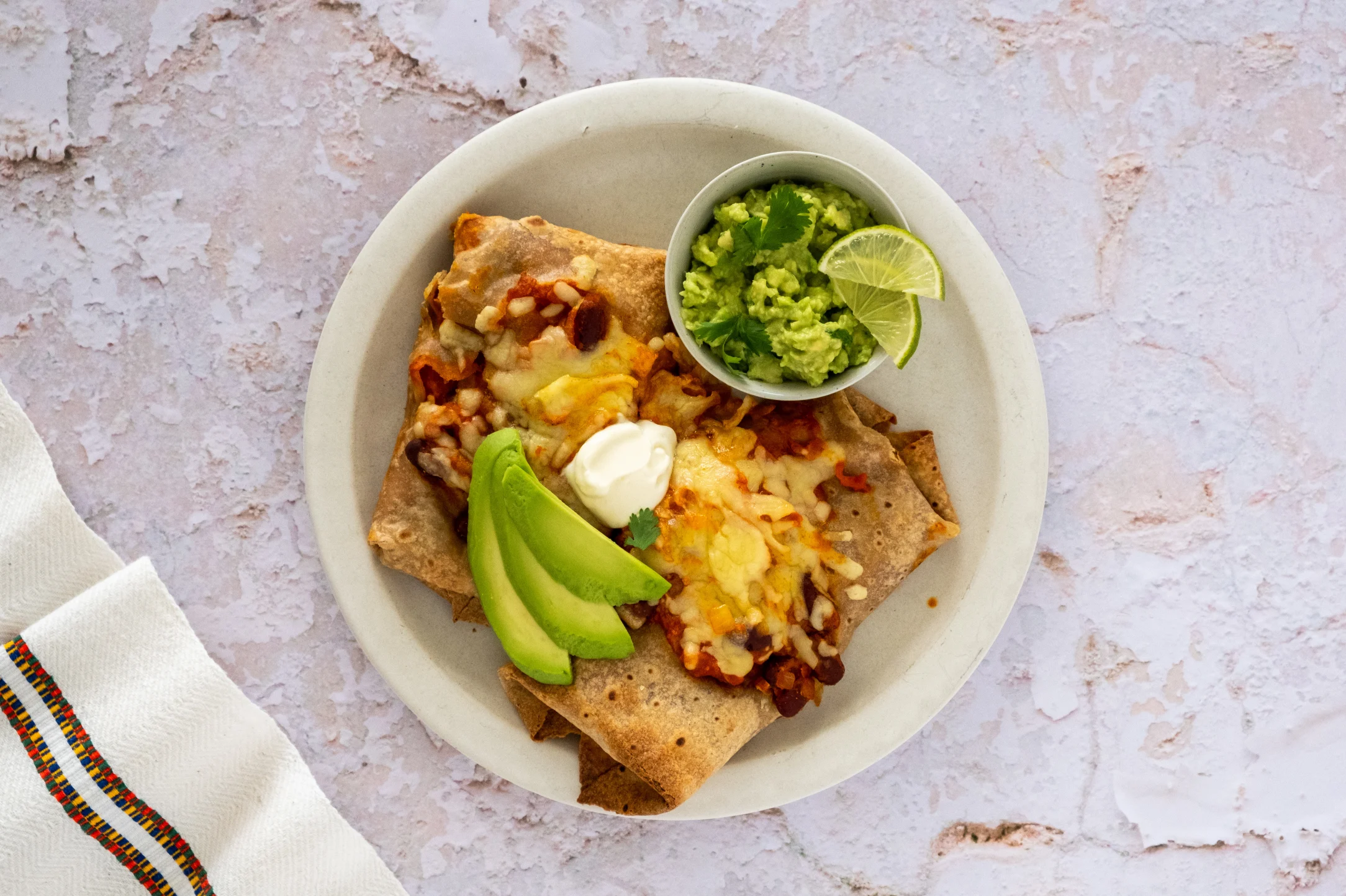 Cheesy Bean Enchiladas with Guacamole