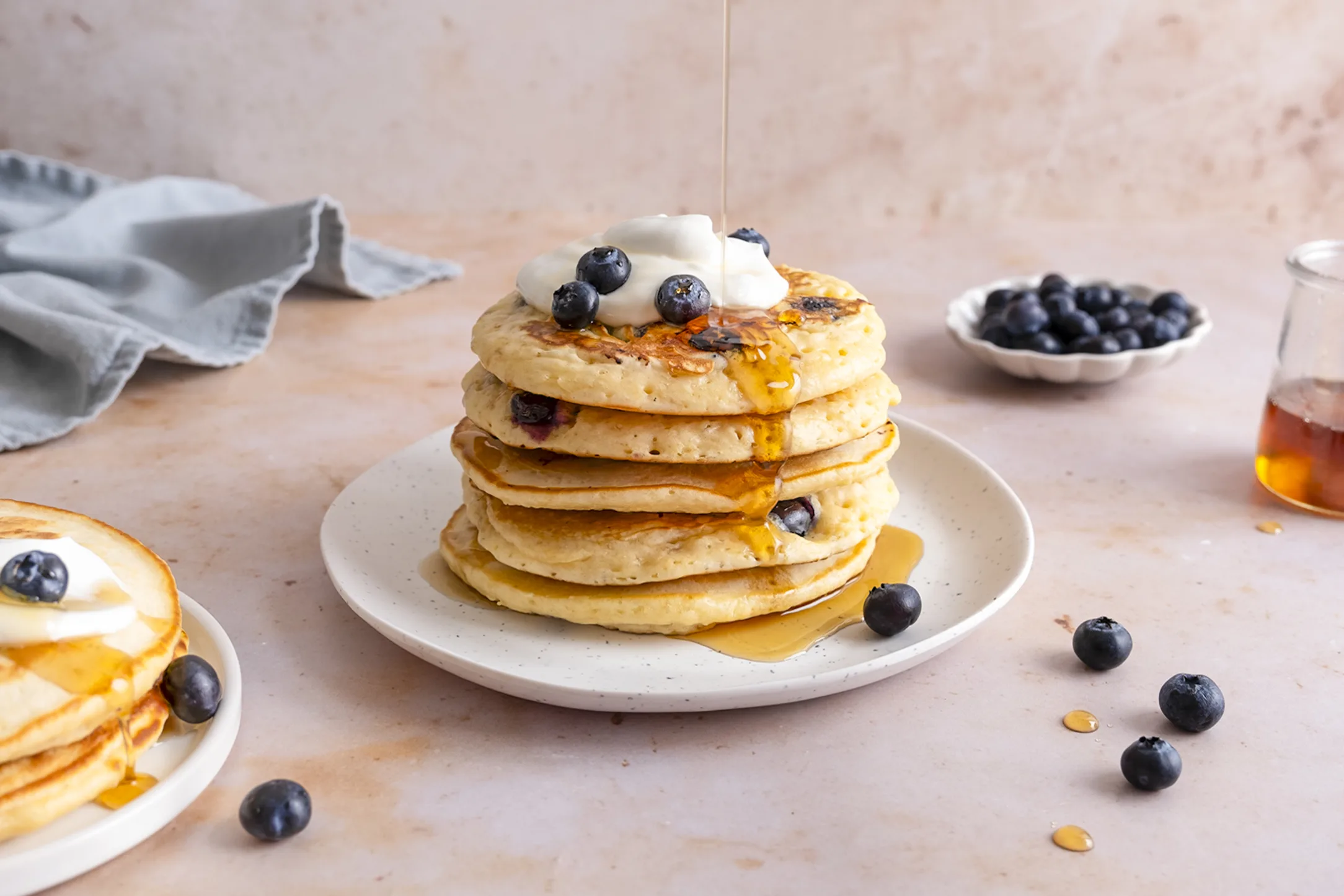 Fluffy Blueberry Pancakes with Creamy Greek Yogurt, Fresh Blueberries and Maple Syrup