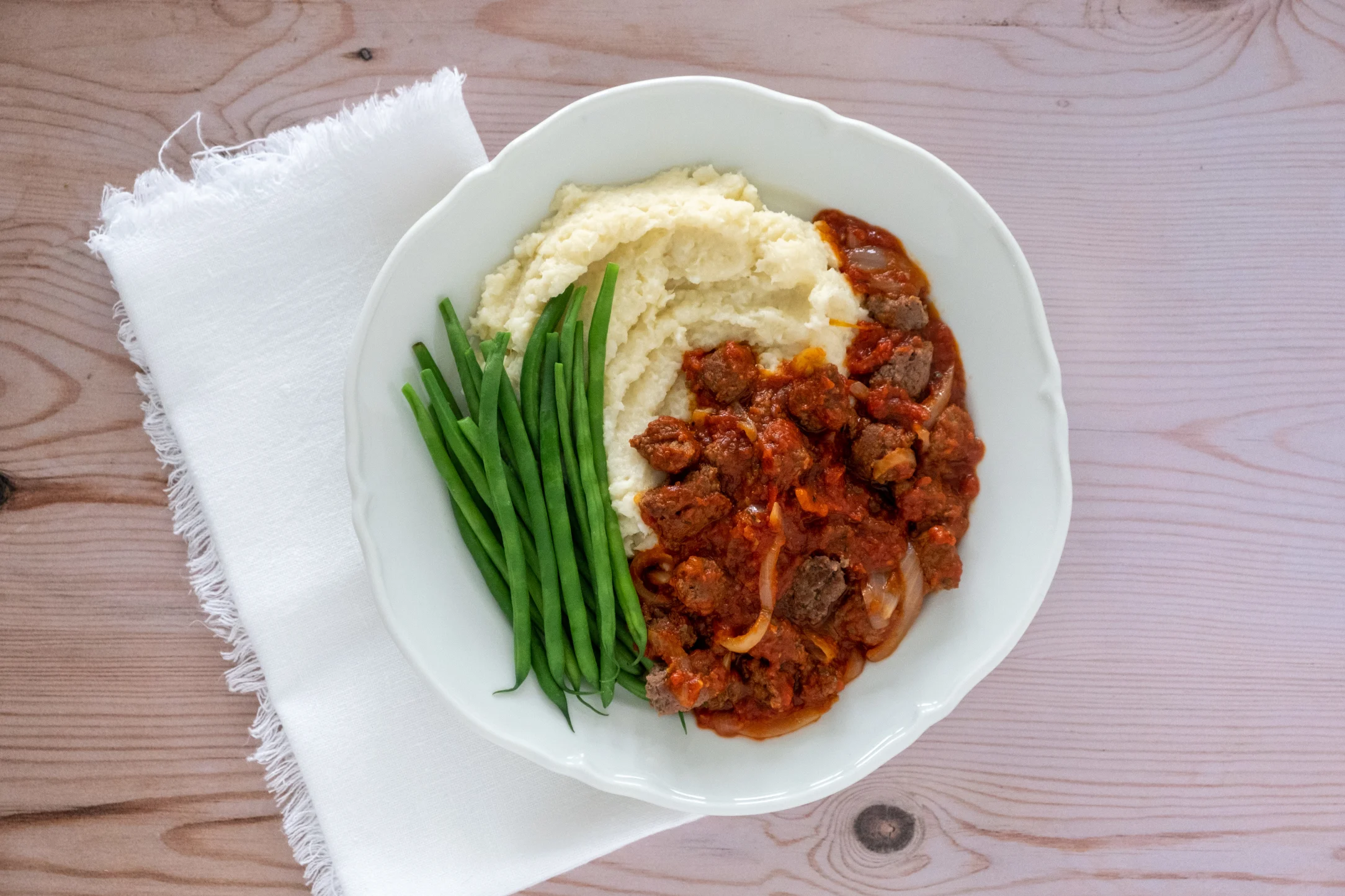 Tomato Sausage Pan over Cauliflower Mash with Green Beans