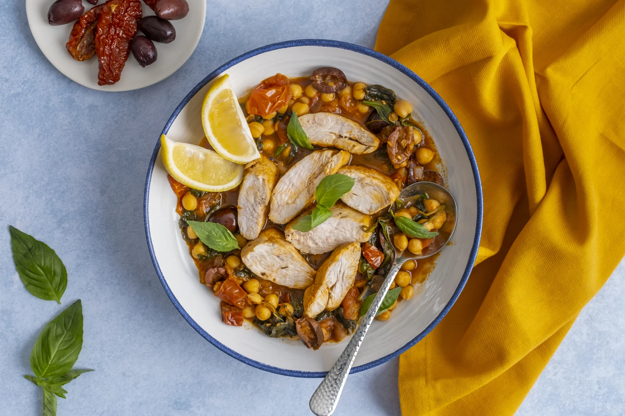 Chicken over Tomato Chickpea Stew with Basil & Kalamata Olives