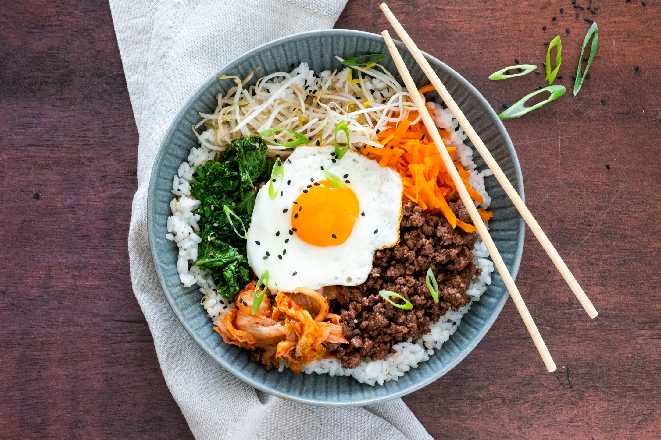 Korean Bibimbap with Spiced Beef, Sesame Kale, Eggs and Kimchi
