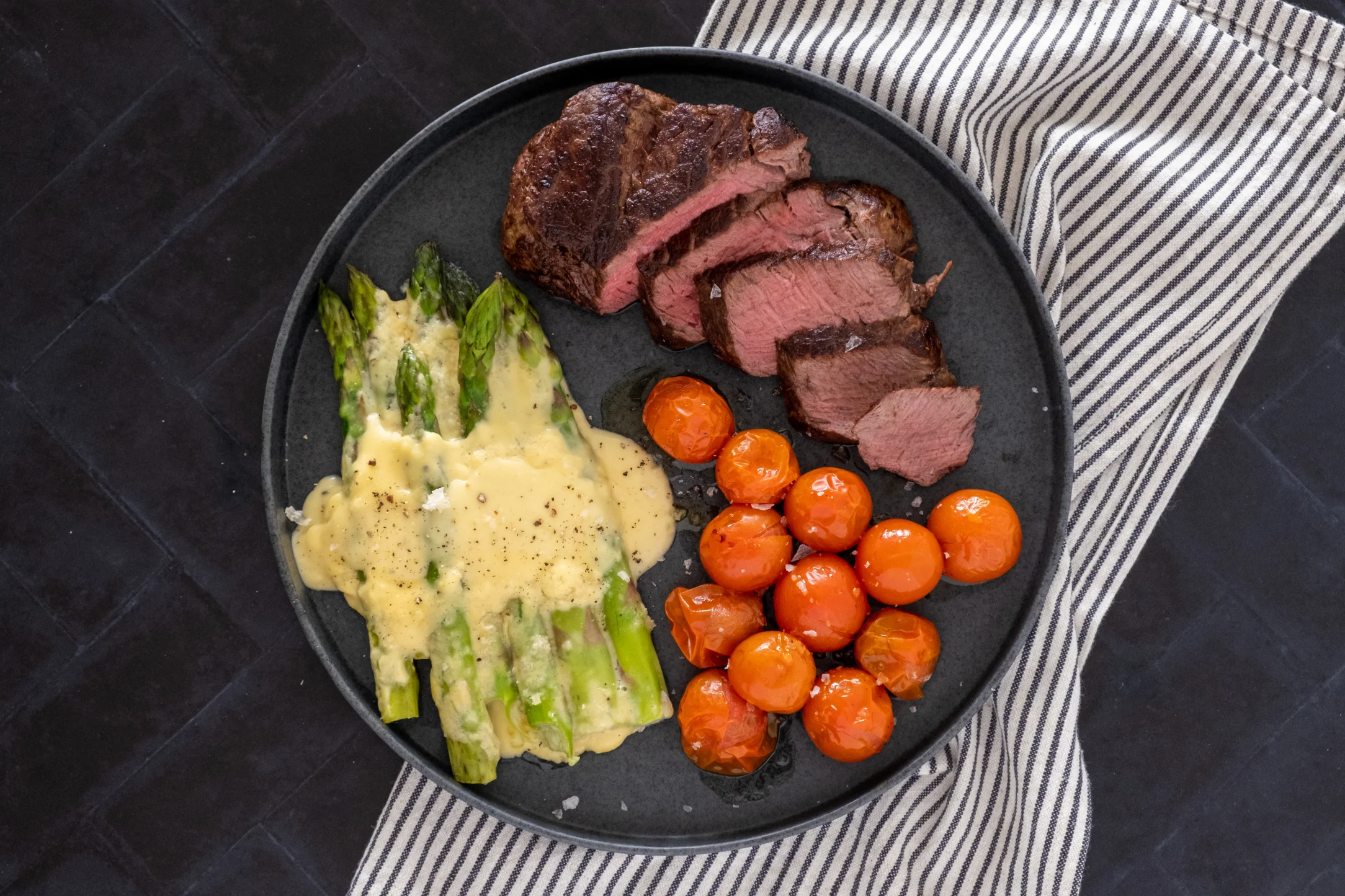 Tenderloin Fillet Steak with Baked Asparagus Cheese and Cherry Tomatoes
