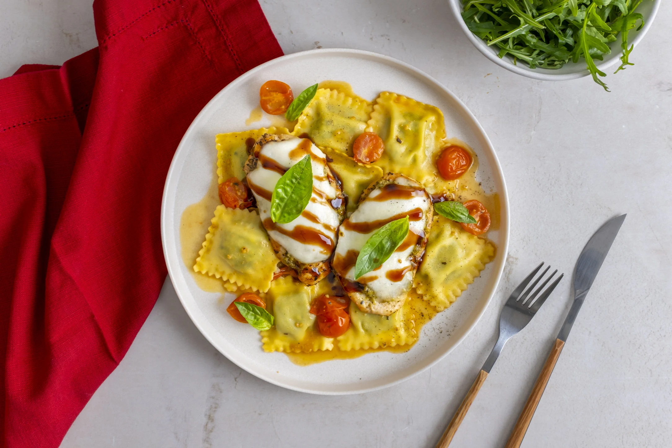 Caprese Chicken and Ricotta Spinach Ravioli with Fresh Mozzarella and Pesto