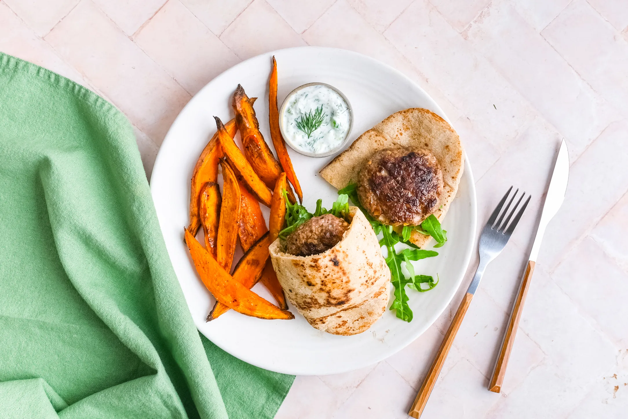 Greek Lamb Burgers in Pitta with Tzatziki & Sweet Potato Wedges