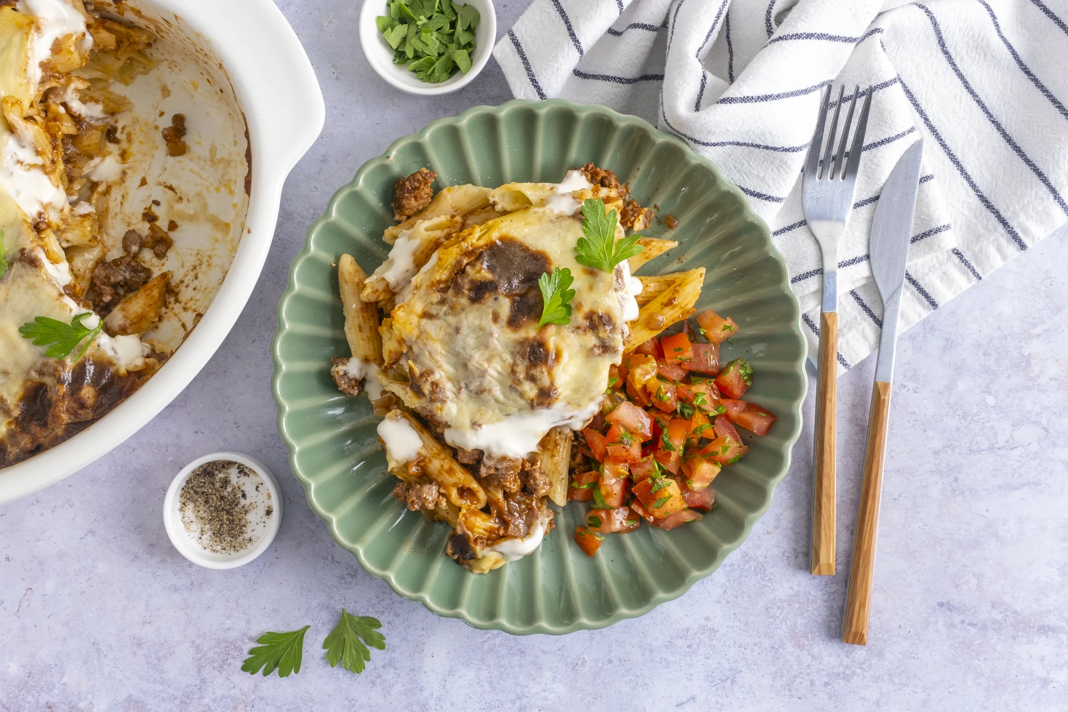 Macarona Bechamel Pasta Bake with a Tomato Salad: A beef mince and bechamel sauce pasta bake
