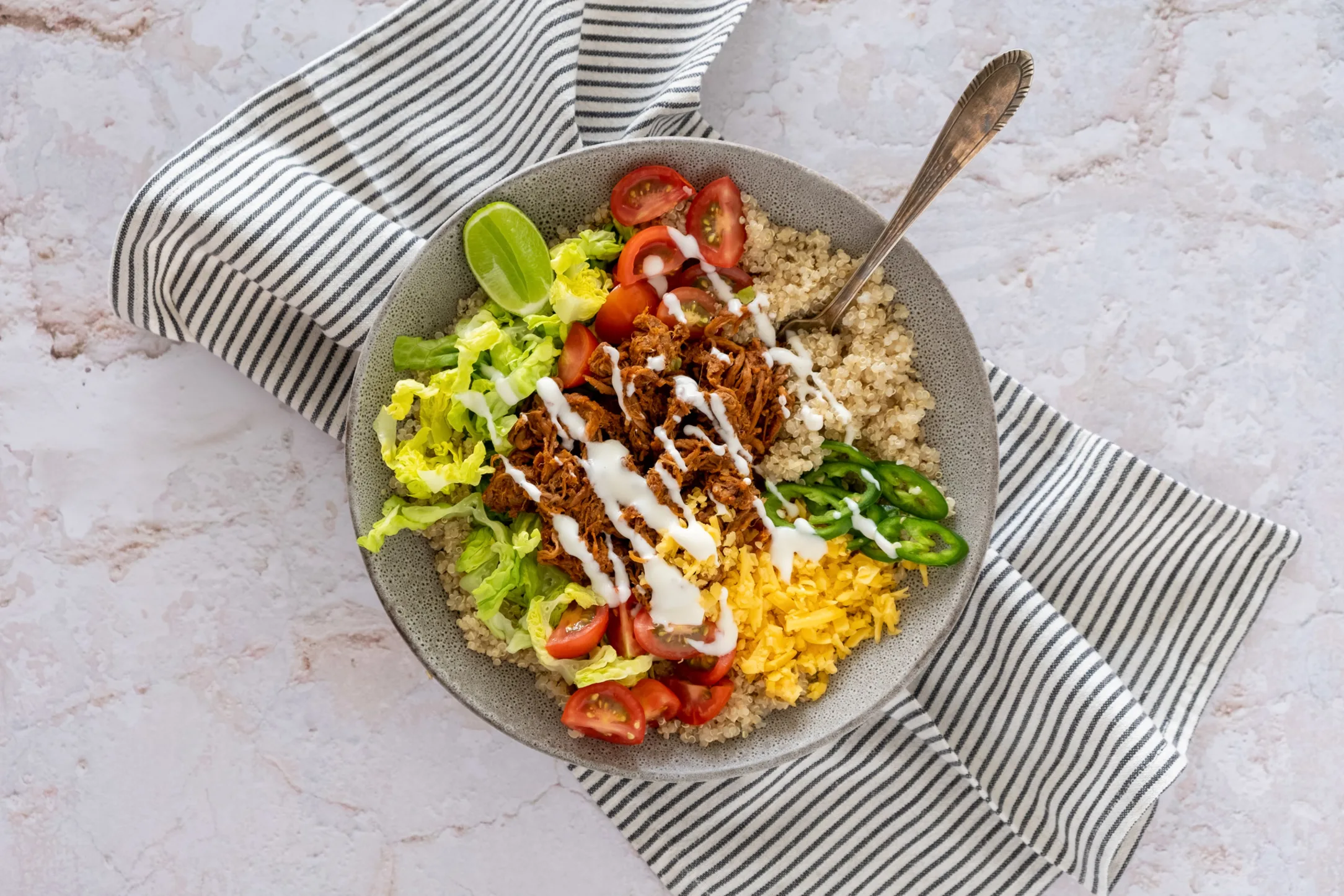 Taco Spiced Pulled Beef Quinoa Bowl with Lime Crema