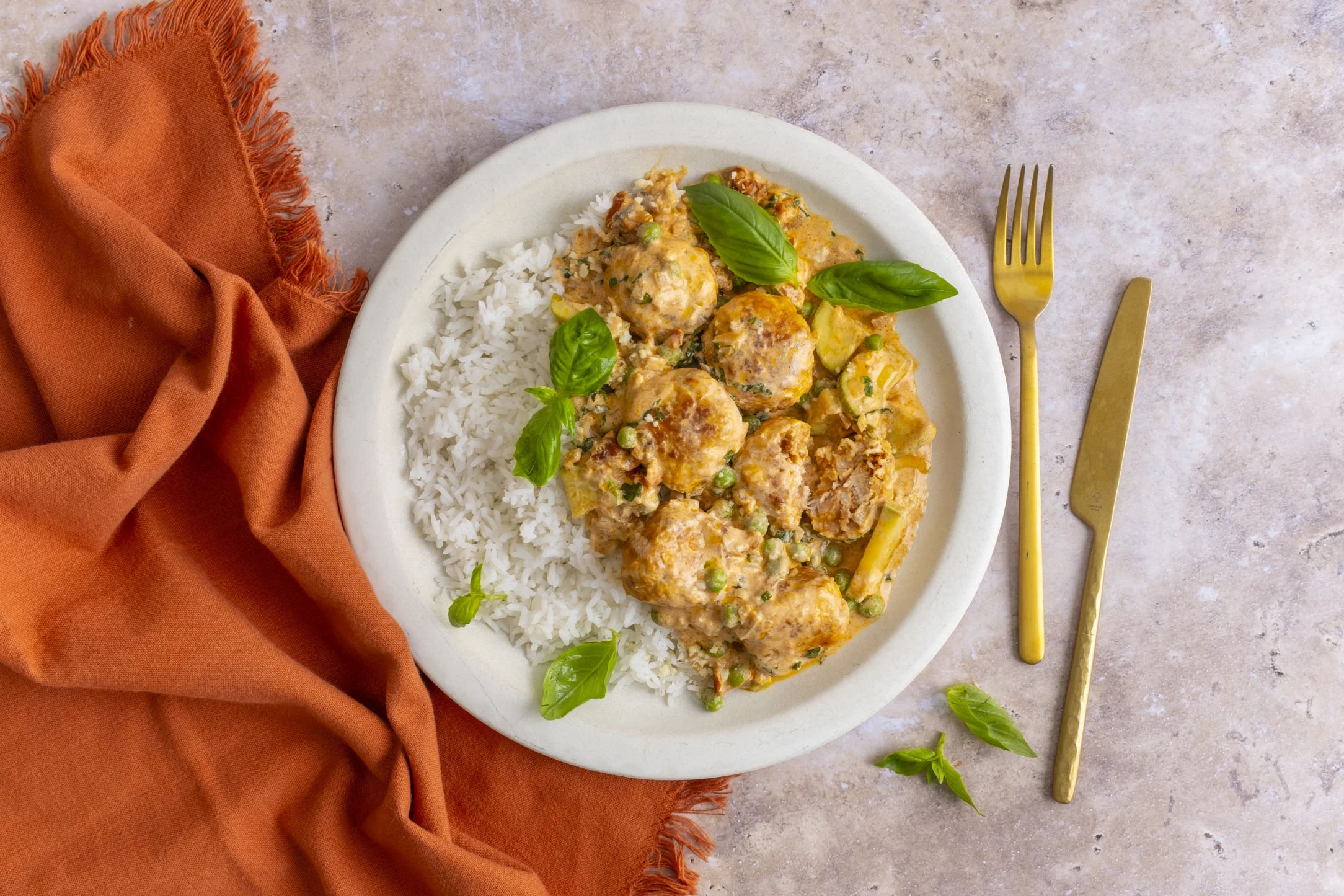 Chicken Meatballs in a Creamy Sun dried Tomato and Basil Sauce with Zucchini, Peas and Rice