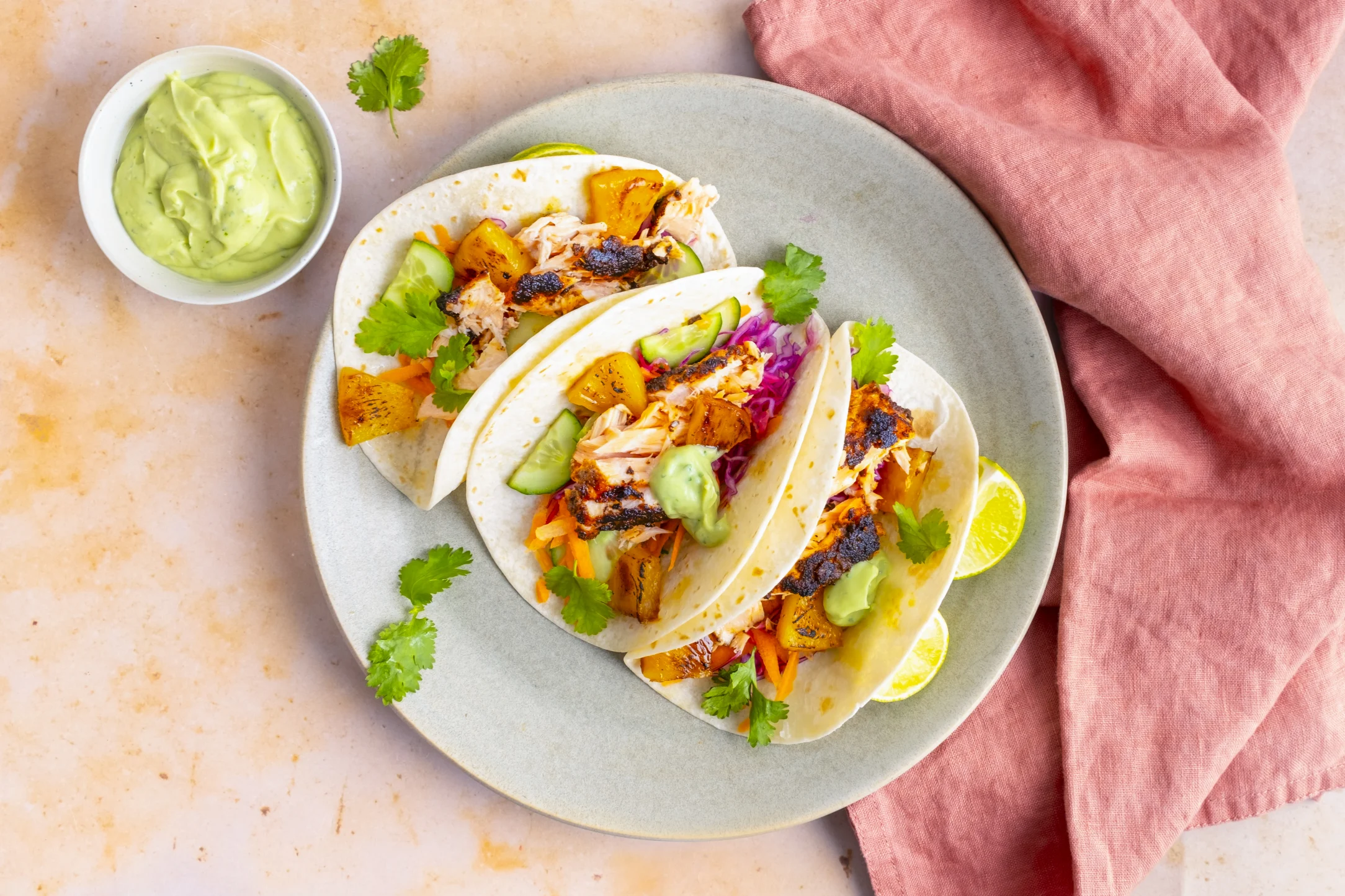 Cajun-spiced Salmon Tacos with Caramelised Pineapple Slaw and Avocado Lime Crema
