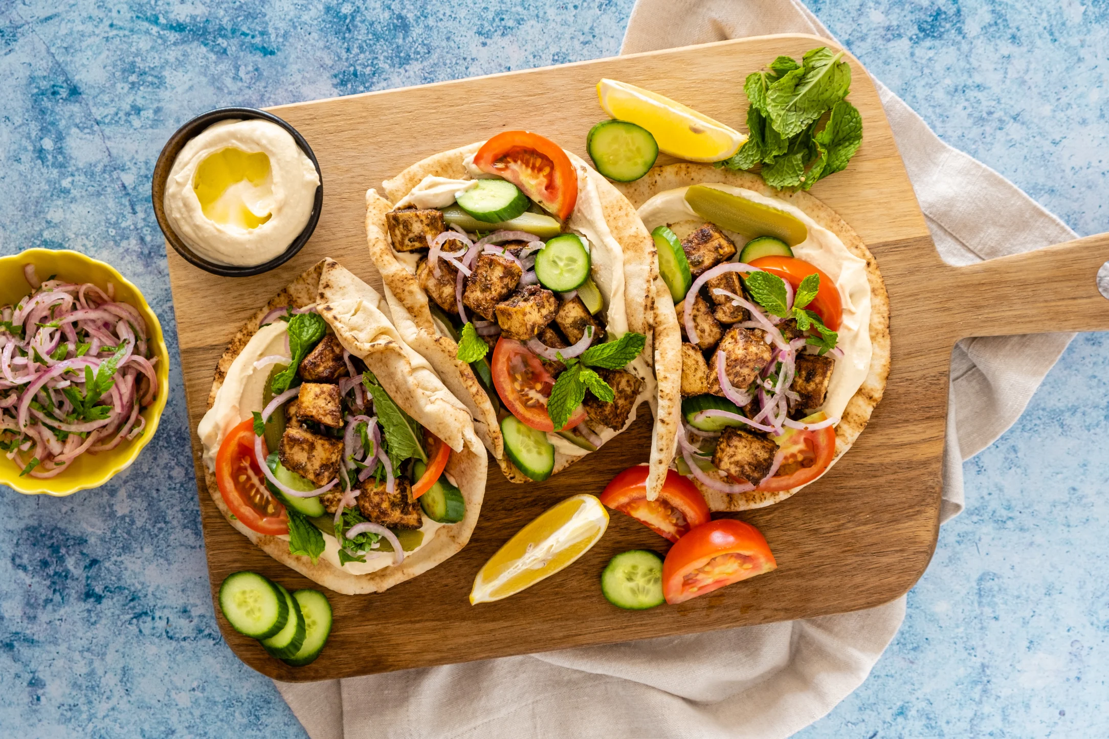 Shawarma Spiced Tofu and Hummus Wraps with Pickled Sumac Onions