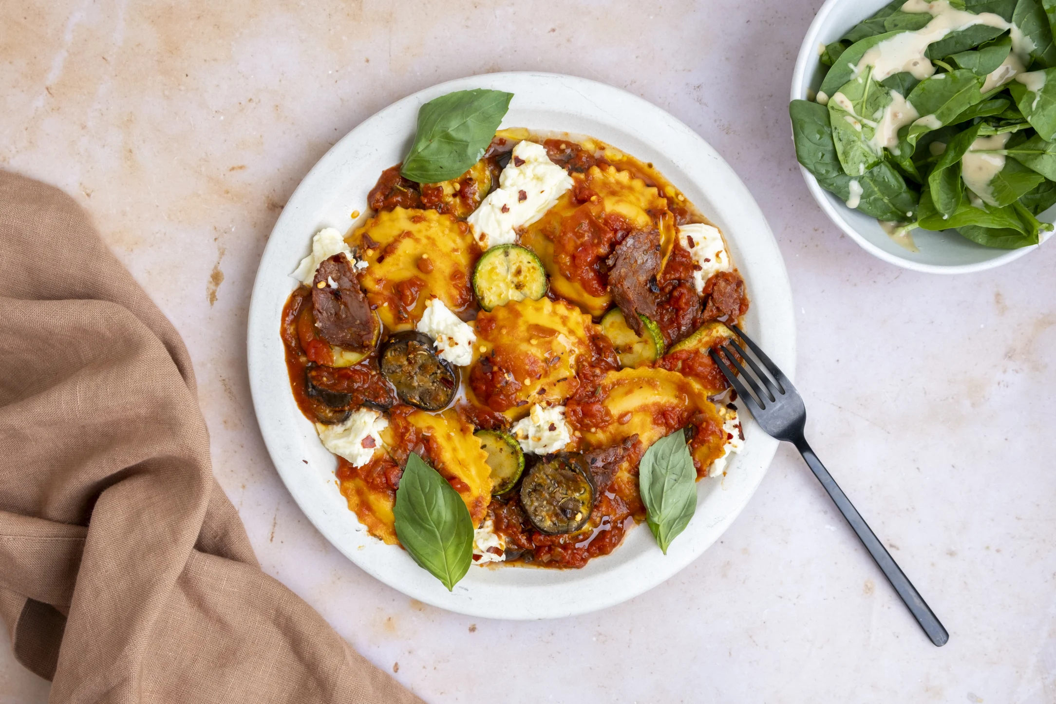 Mediterranean Eggplant Ravioli and Spicy Chorizo in Tomato Sauce with Fresh Mozzarella