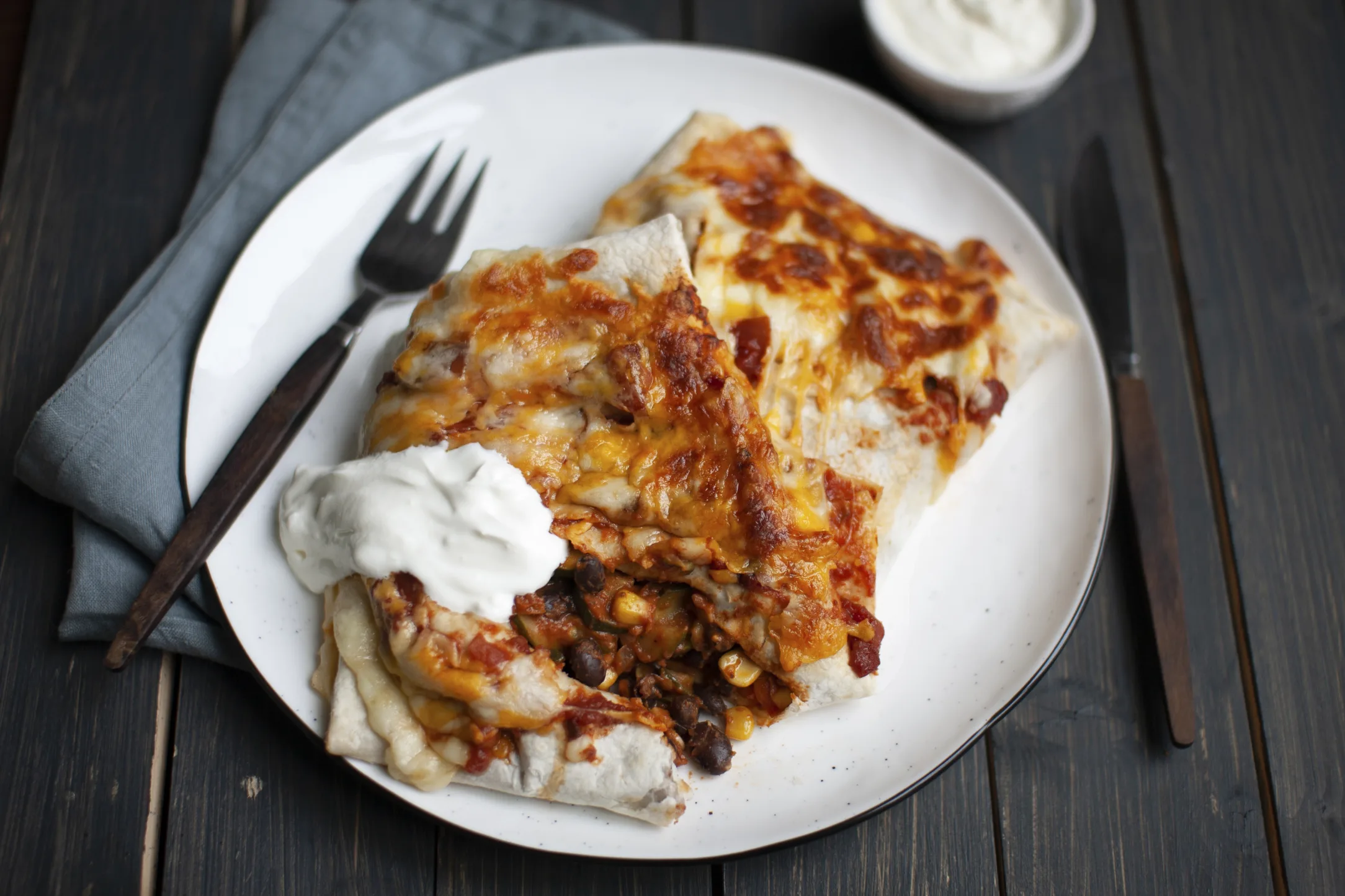 Black Bean and Corn Veggie Enchiladas with Sour Cream