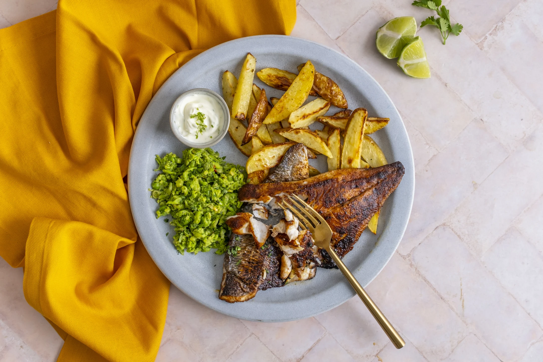 Caribbean-Style Seabream with Chilli Herb Peas, Fries and Lime Crema