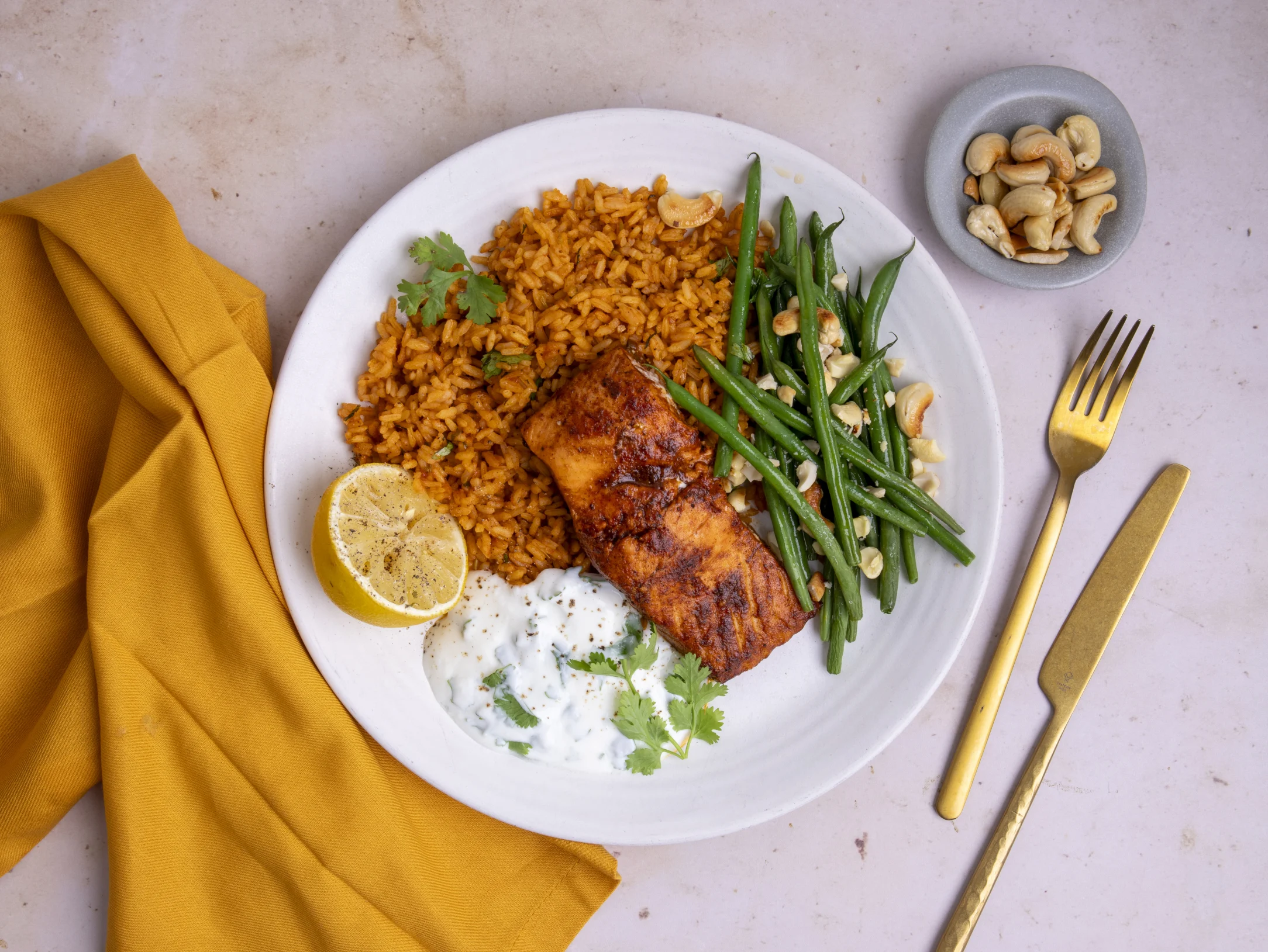 Baharat Salmon and Tomato Rice Pilaf with Coriander Yogurt and Cashews