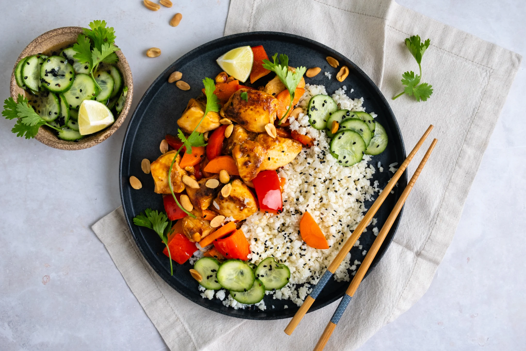 Chicken Stir-fry in Chinese Chilli Sauce with Garlic Cauliflower Rice and Sesame Cucumbers