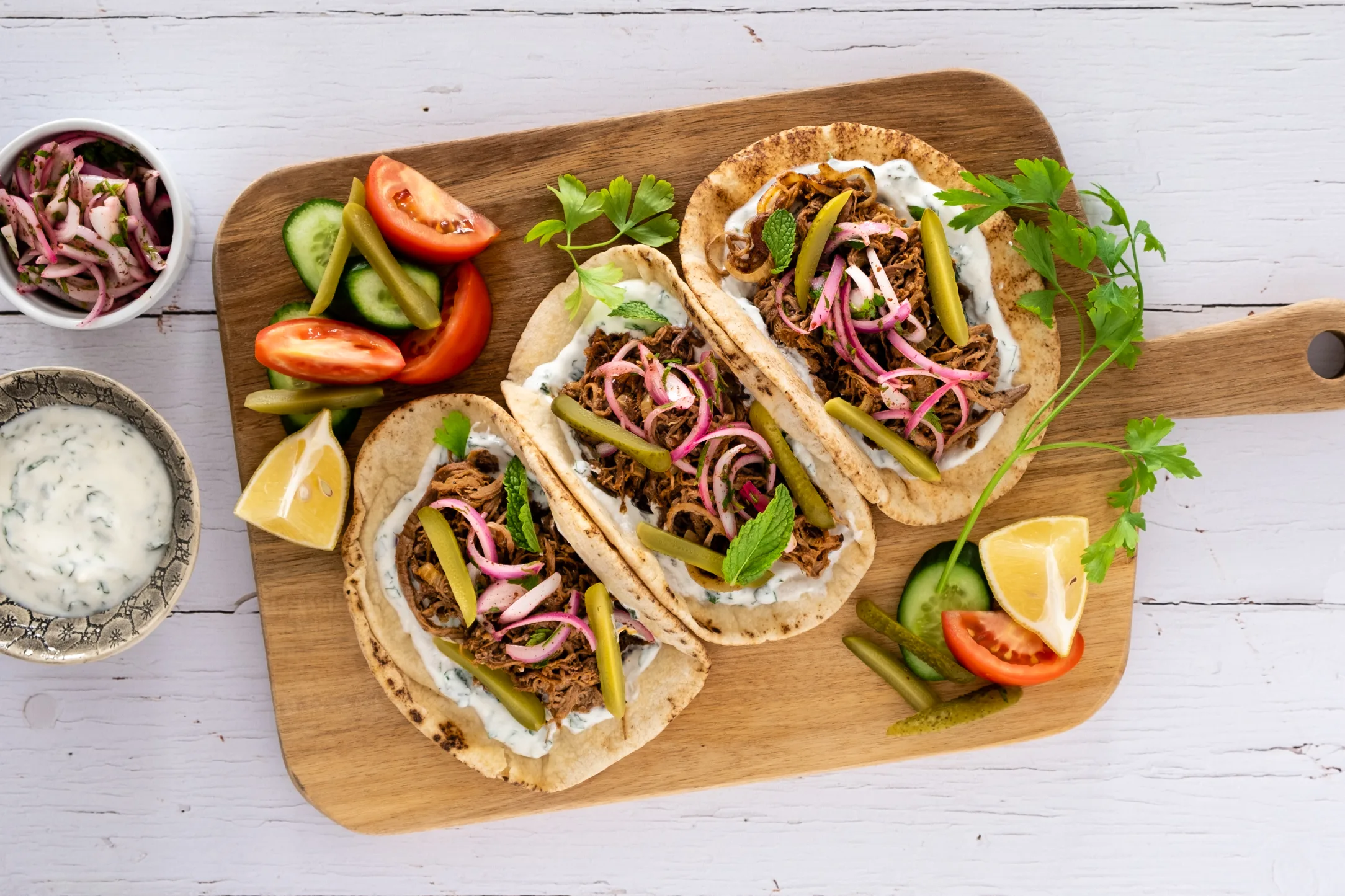 Shawarma Spiced Pulled Beef Flatbreads with Pickled Sumac Onions and Garlic Mint Yogurt