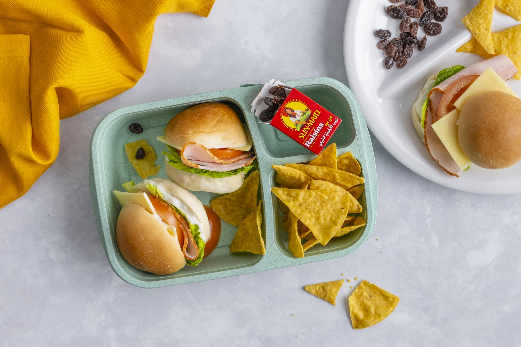 Turkey Breast Slice and Salad Sandwich with Crispy Corn Chips and Snack Raisins