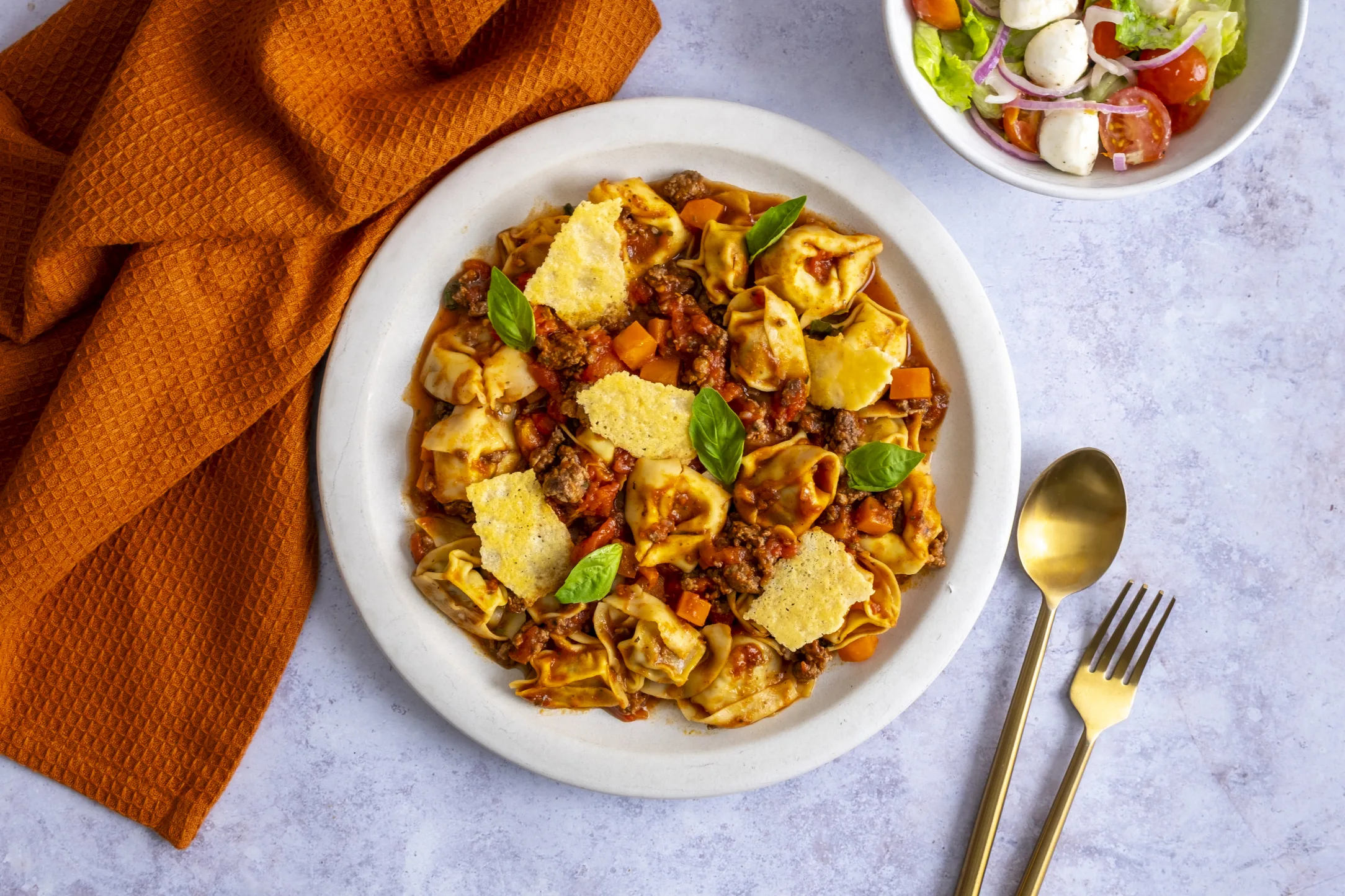 Bolognese Ragu and Porcini Mushroom Tortellini with Parmesan Crisps and Italian Salad