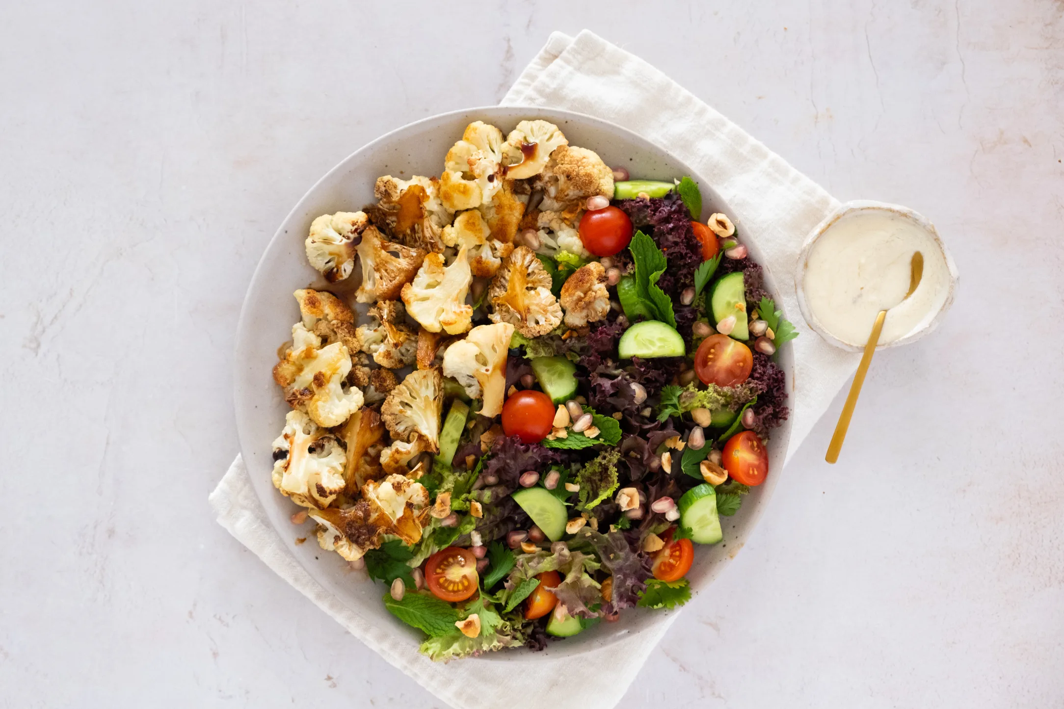 Baked Cauliflower and Herb Salad with Tahini Sauce