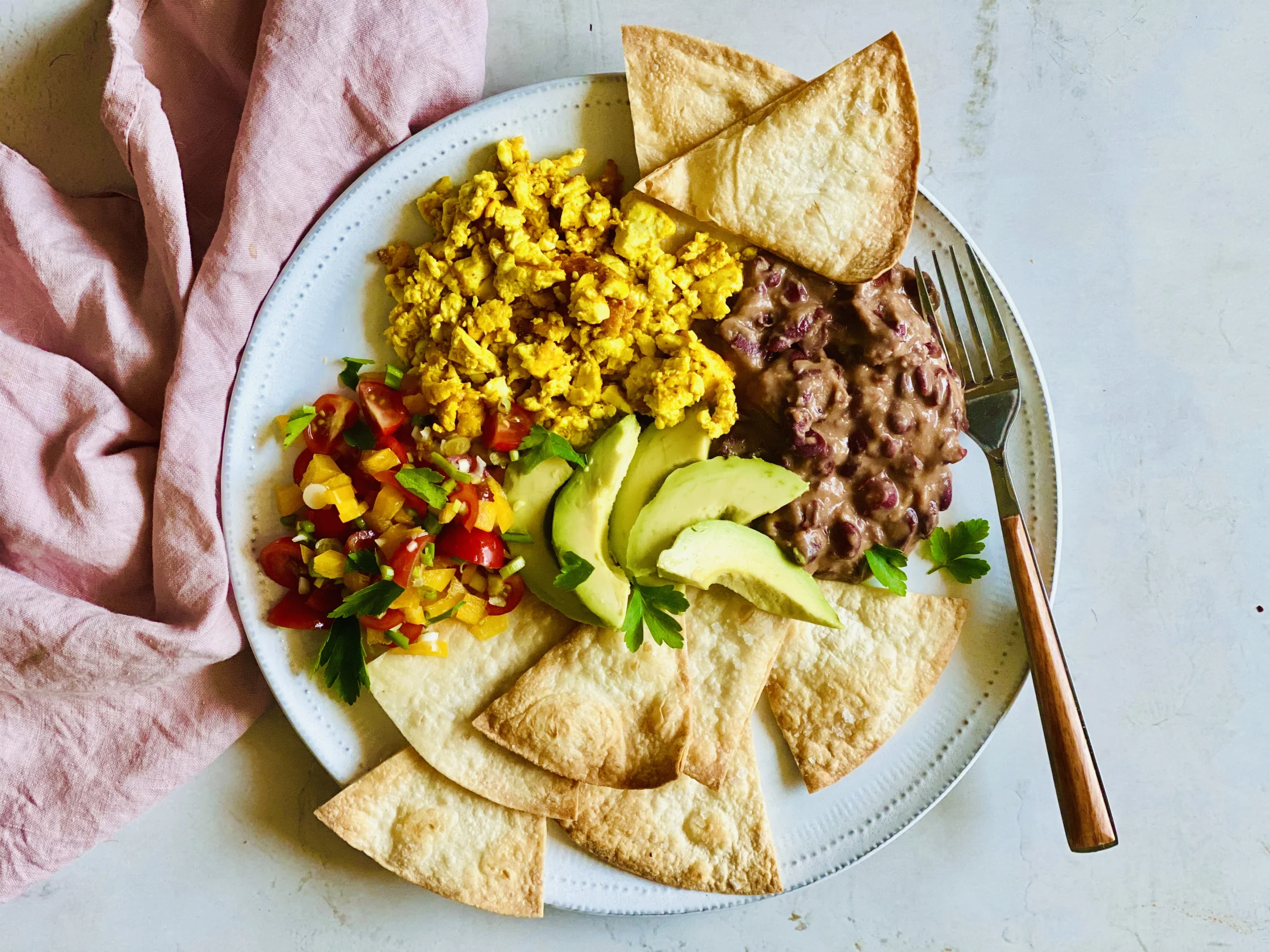Mexican Tofu Scramble with Re-fried Beans, Salsa, Crispy Tortillas and Avo