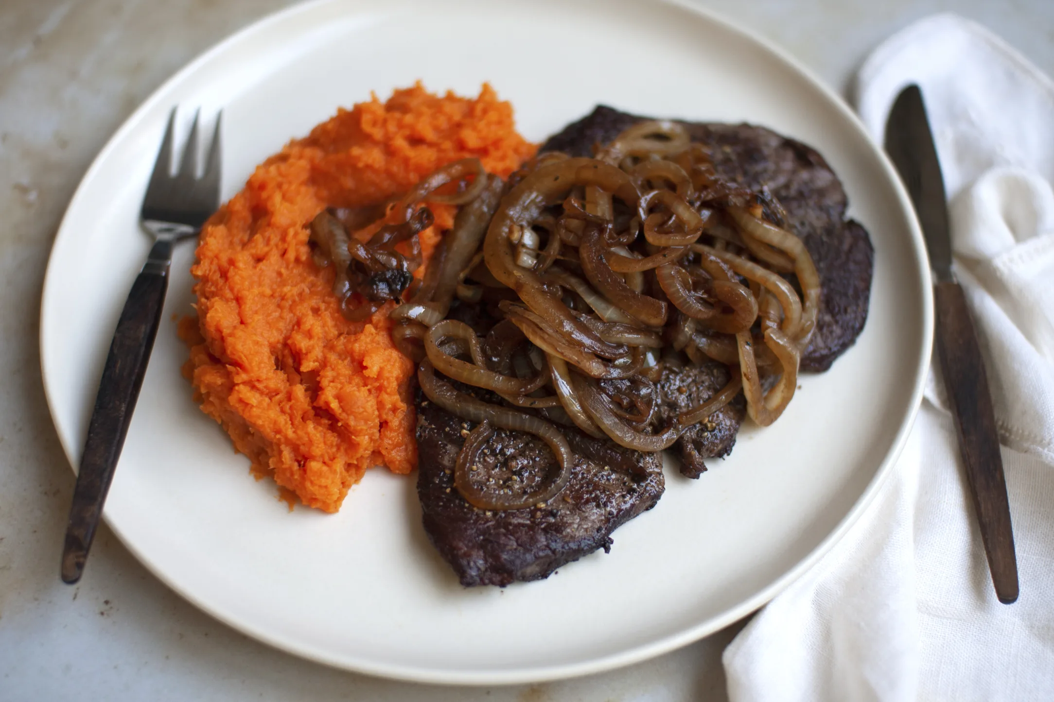 Minute Steak with Sweet Potato Mash and Caramelized Onions