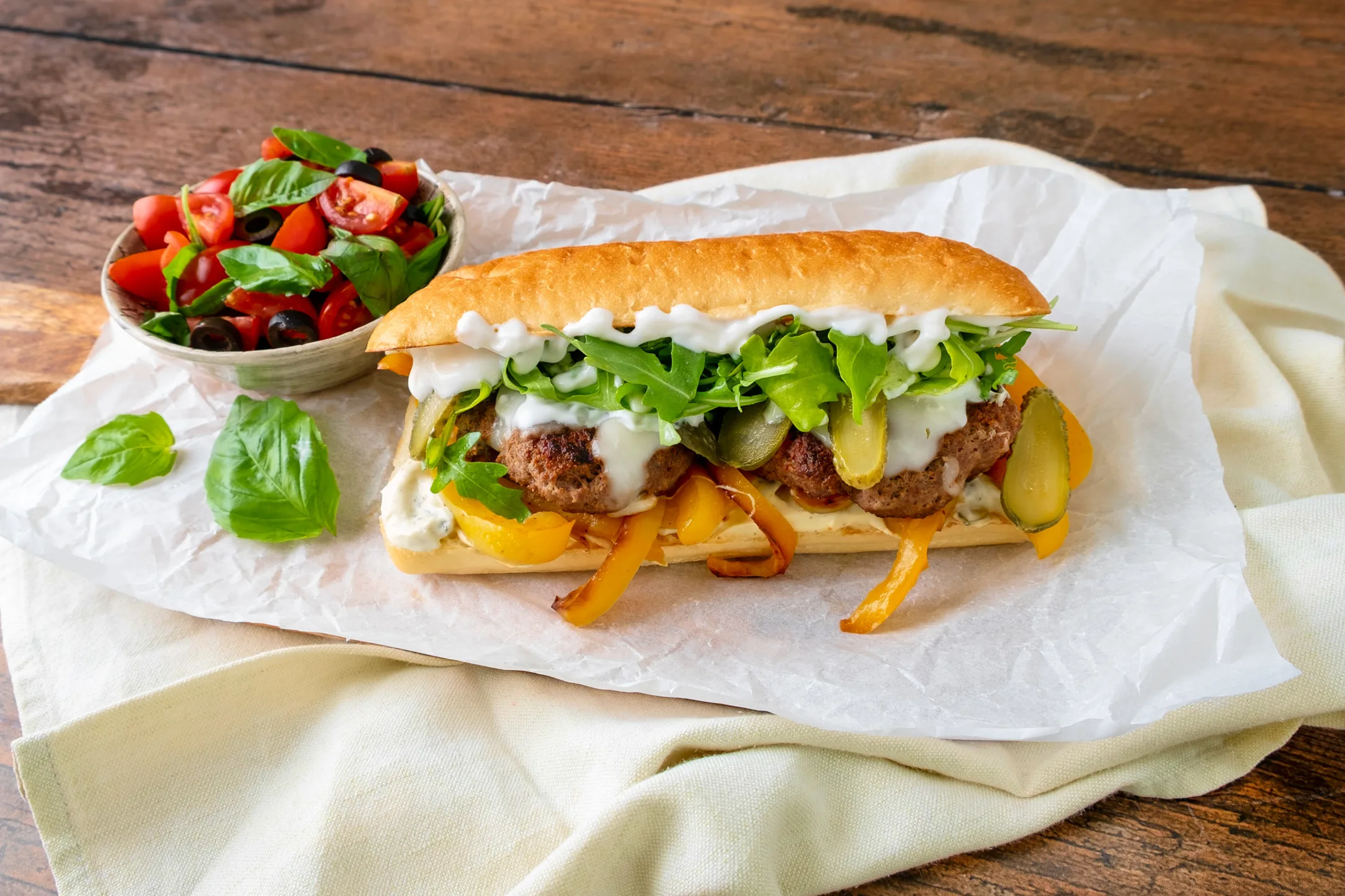 Italian Sausage Sandwich with Tomato and Basil Salad