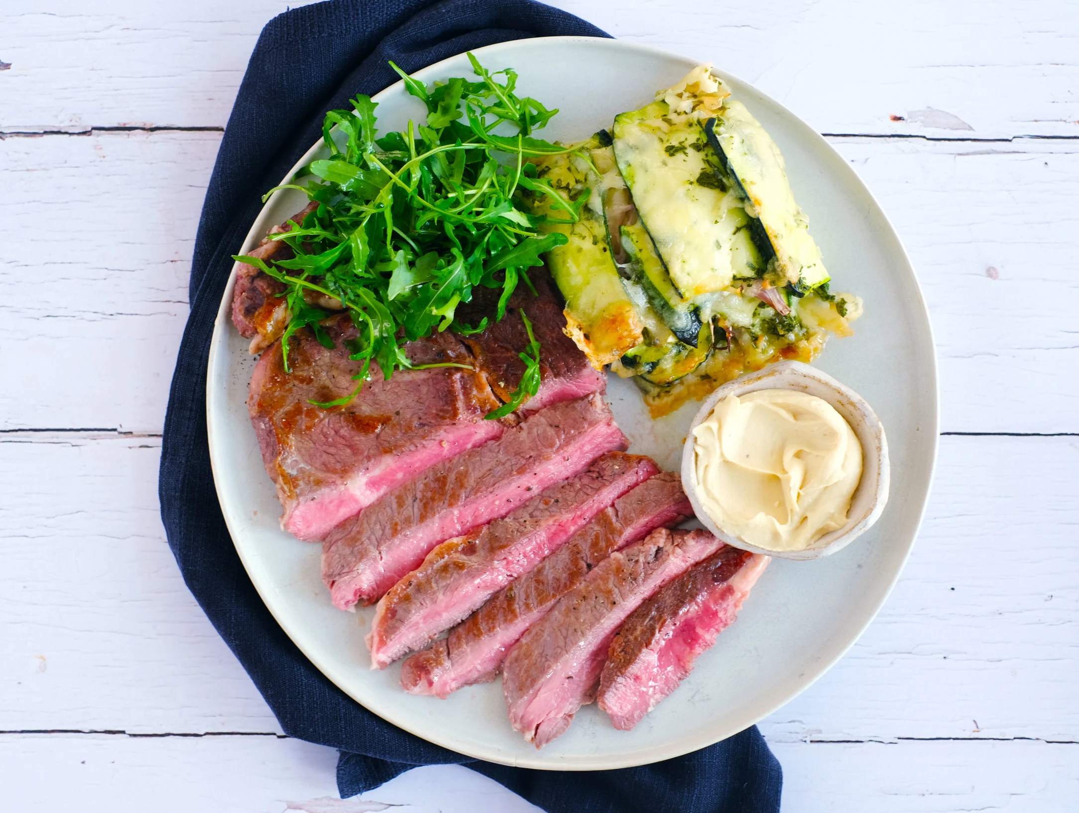 Steak with Zucchini Gratin au Gruyere and Dijon Sauce