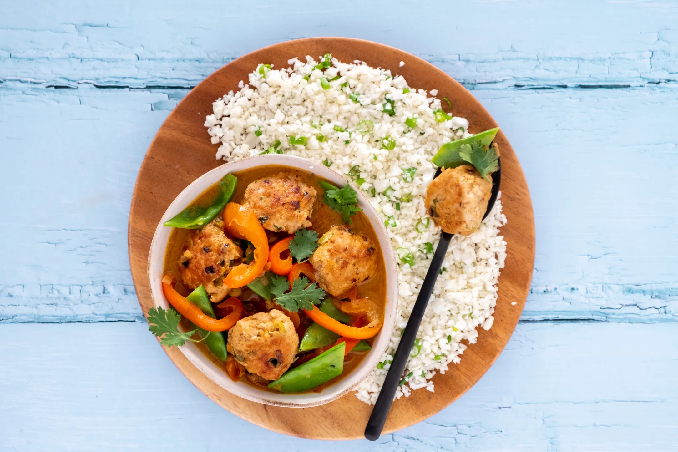 Spicy Thai Chicken Meatballs in Creamy Red Curry Sauce with Cauliflower Rice