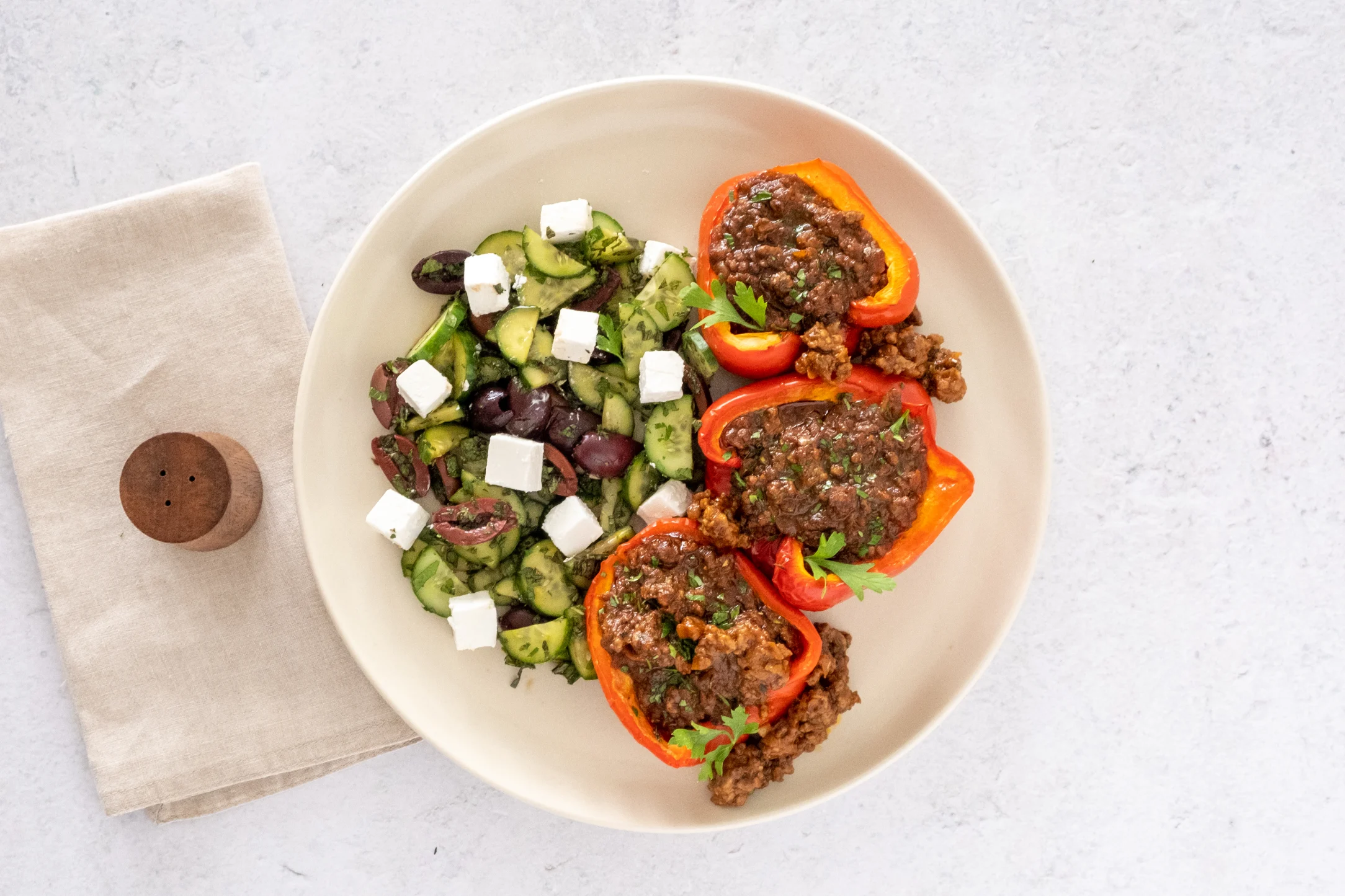Roasted Bolognese Stuffed Peppers with Cucumber, Feta and Olive Salad
