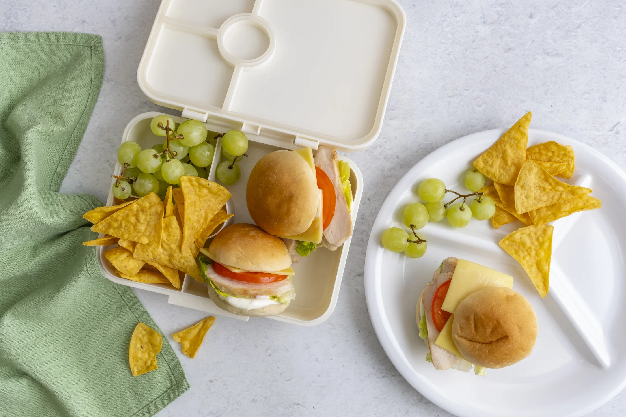Chicken and Salad Sandwich with Crispy Corn Chips and Green Grapes
