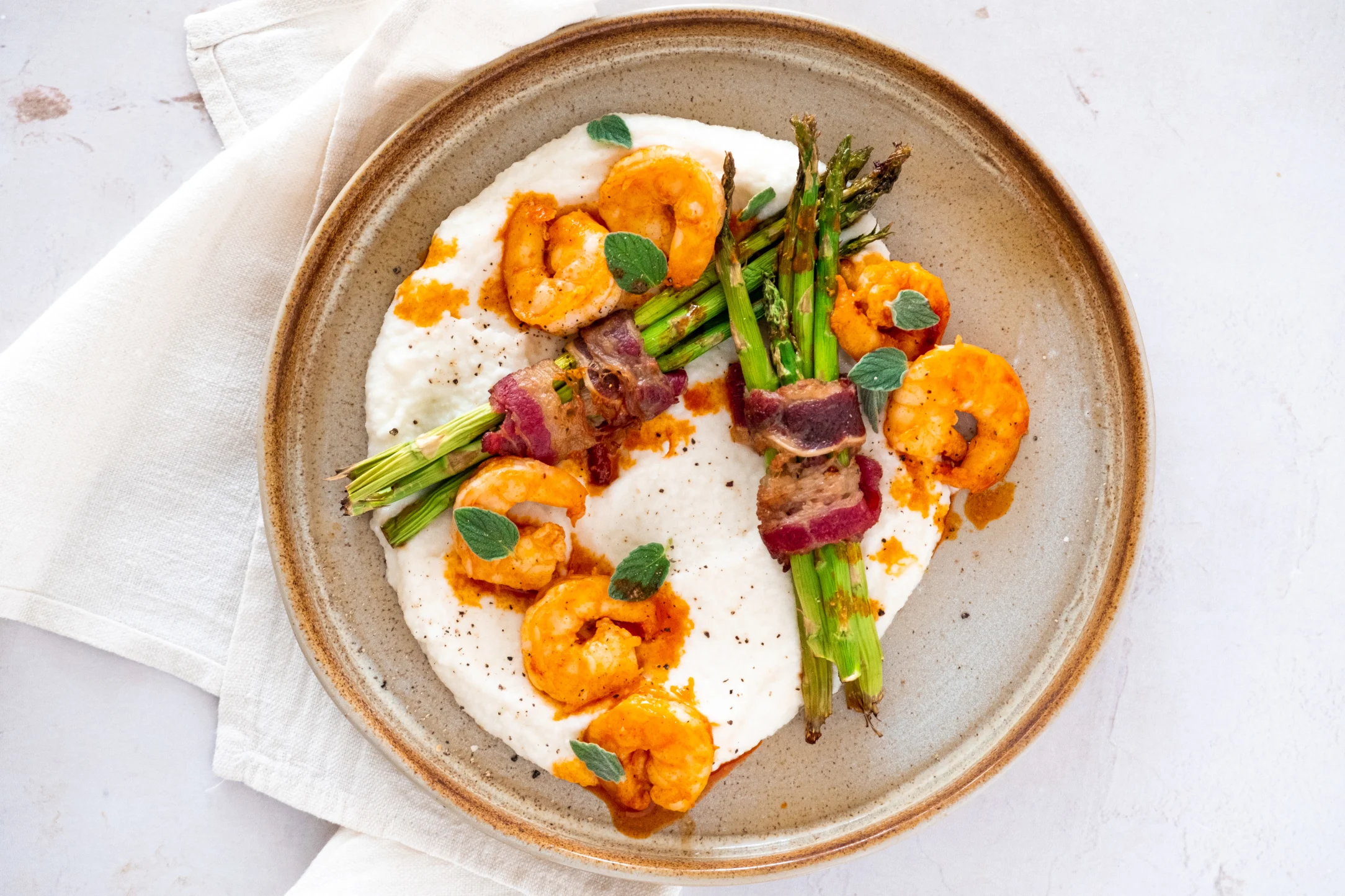 Surf N' Turf Prawns and Bacon Wrapped Asparagus over Creamy Cauli Puree