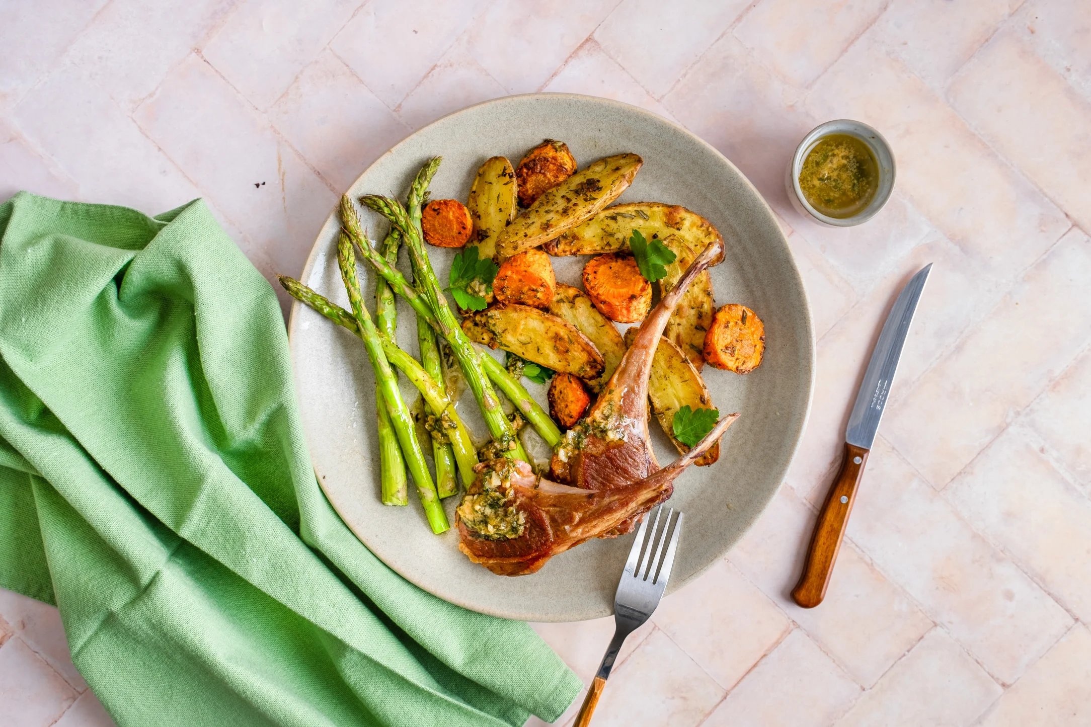Lamb Chops and Garlic Butter Sauce with Roasted Fingerling Potatoes, Carrots and Asparagus