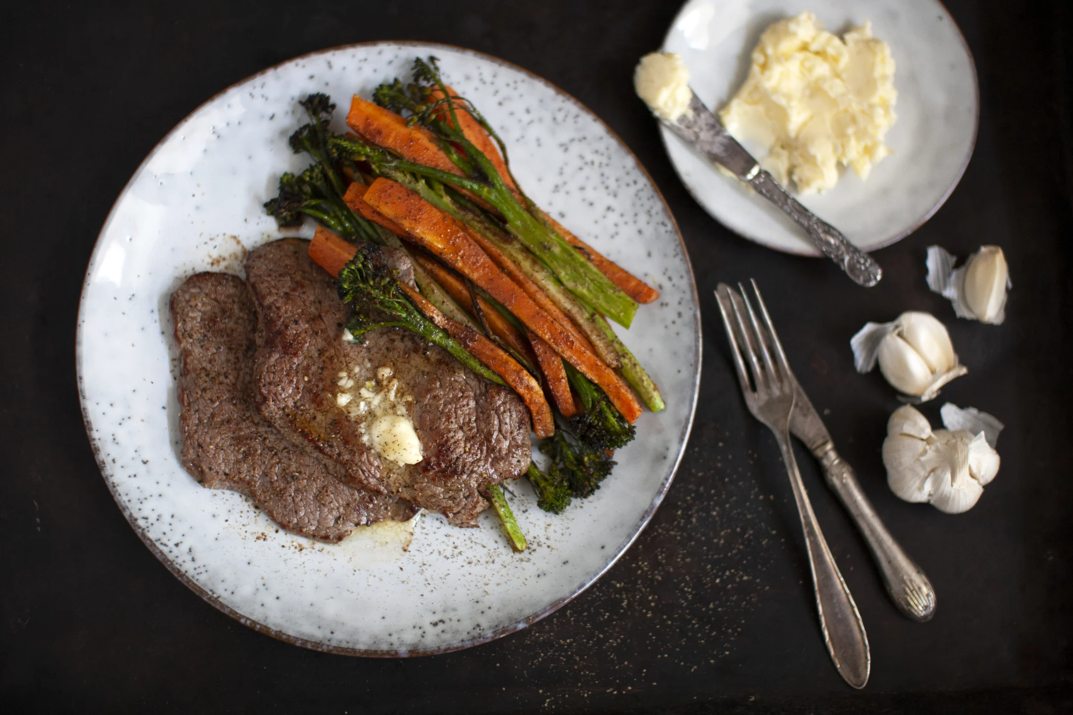 Minute Steak with Roasted Broccolini and Carrots Topped with Garlic Butter