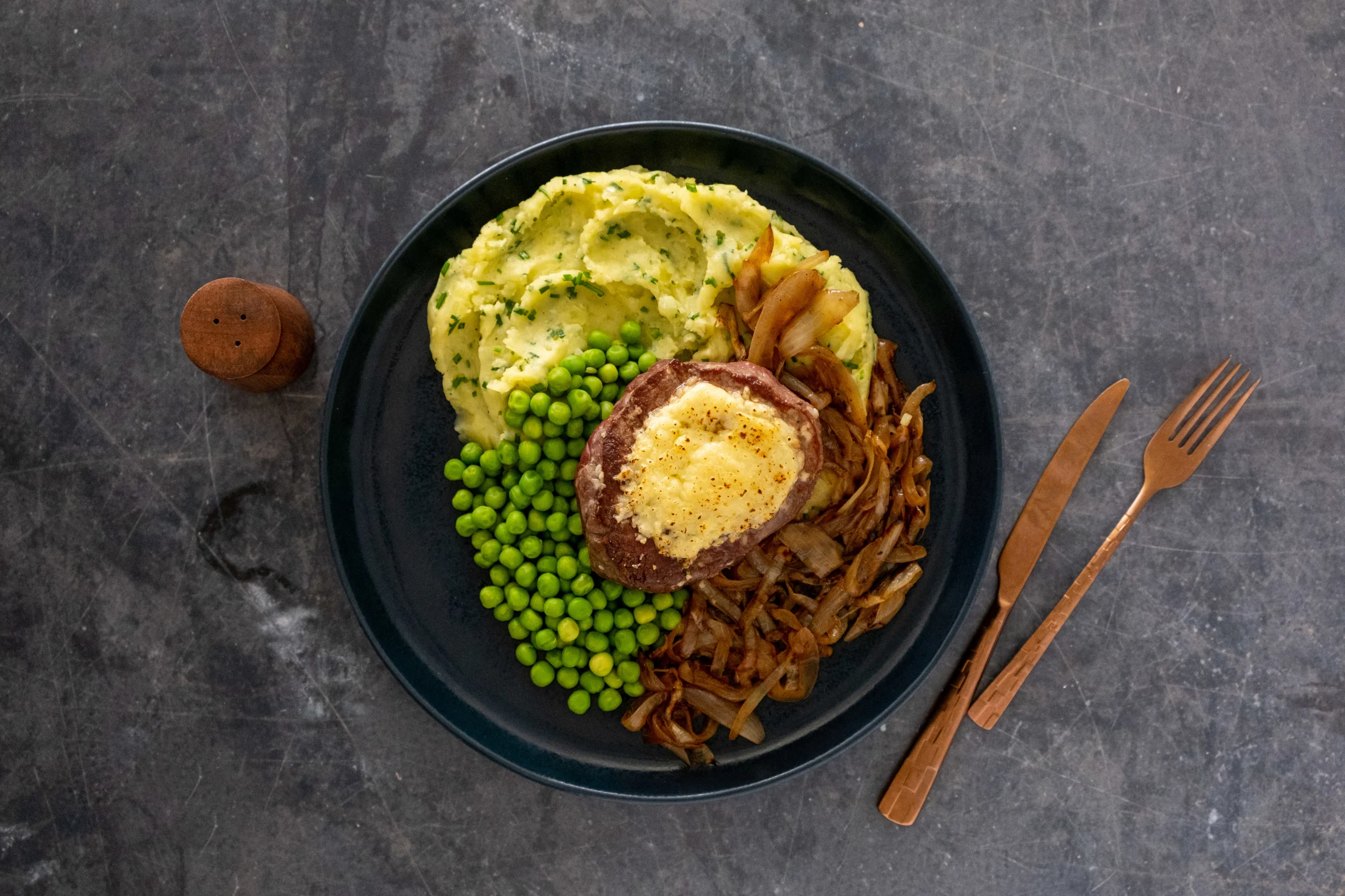 Tenderloin Fillet Cheese Steak with Caramelised Onions, Garlic Mash and Peas