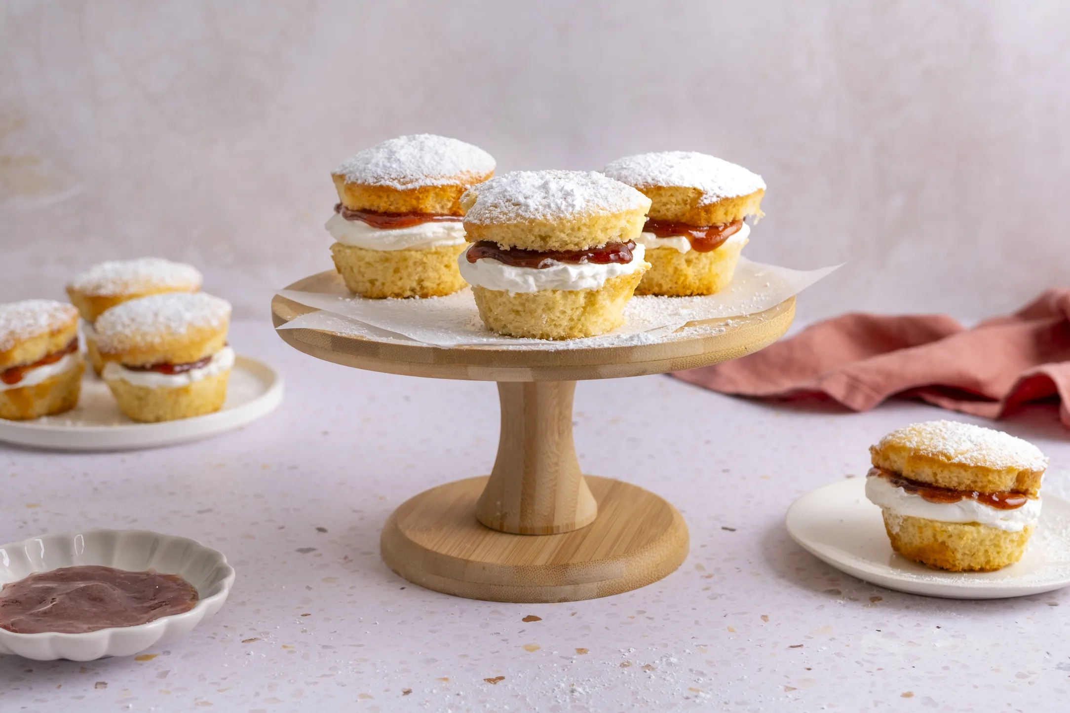 Vanilla Sponge Cupcakes with Whipped Cream and Strawberry Jam