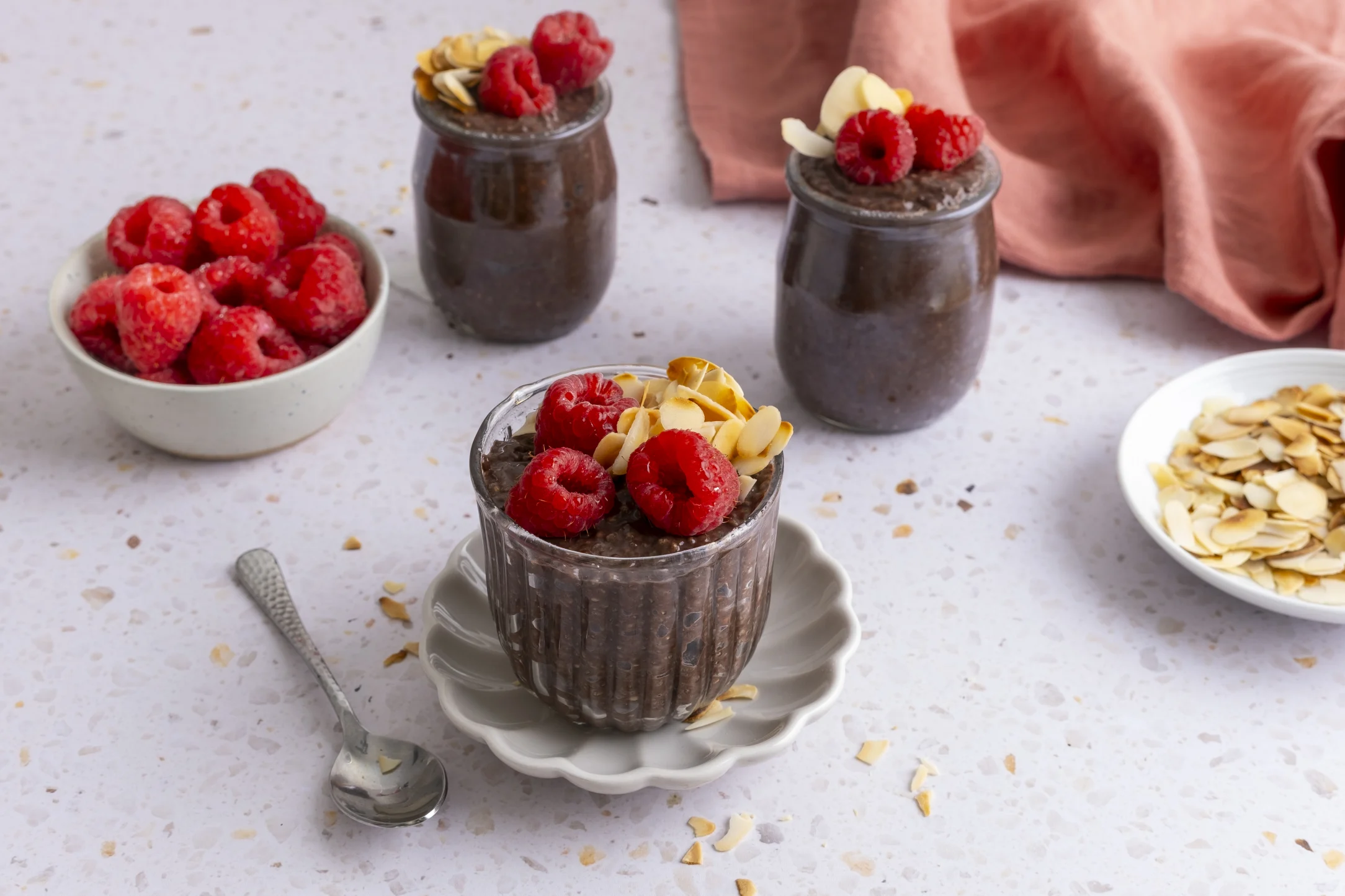 Chocolate Overnight Chia Pudding with Whole Milk, Fresh Raspberries and Almond Flakes