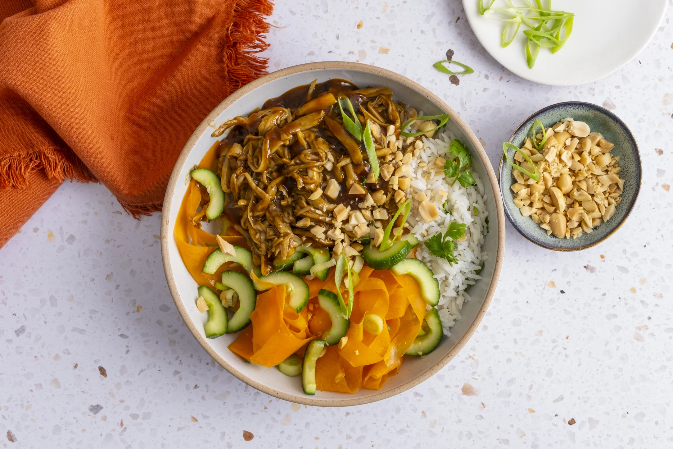 Hoisin Pulled King Oyster Mushroom Rice Bowl with Carrot and Cucumber Salad