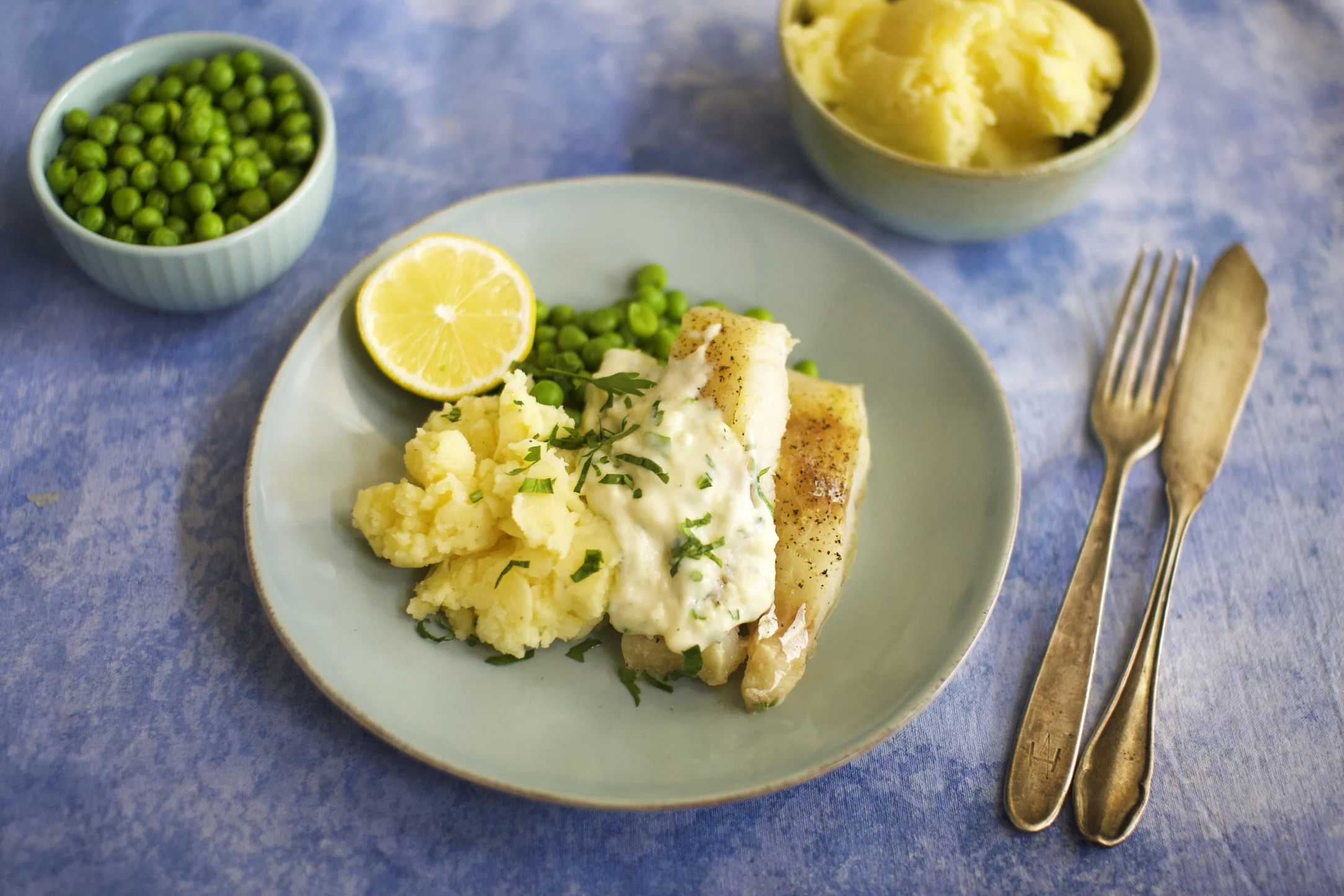 Baked Cod with Mashed Potatoes and White Parsley Sauce