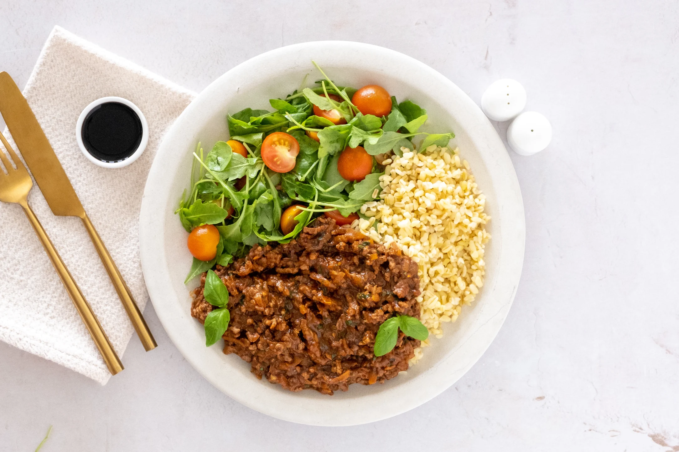 Bolognese with Bulgur Wheat and a Cherry Tomato and Rocket Salad