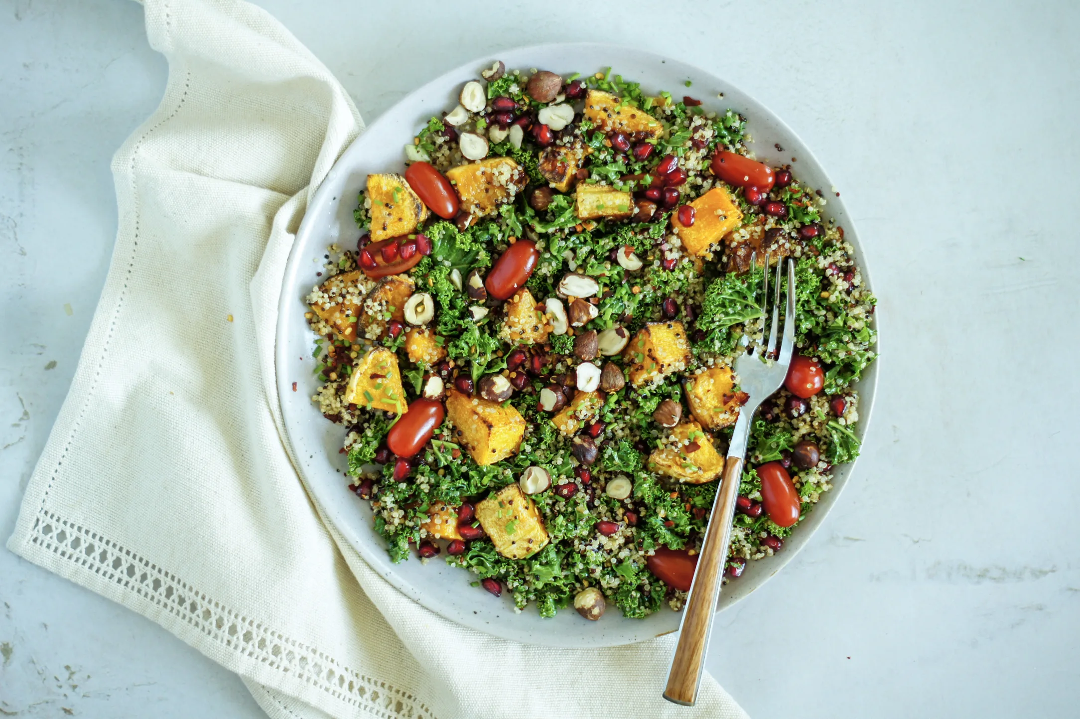 Kale and Squash Quinoa Bowl with Pomegranate Seeds