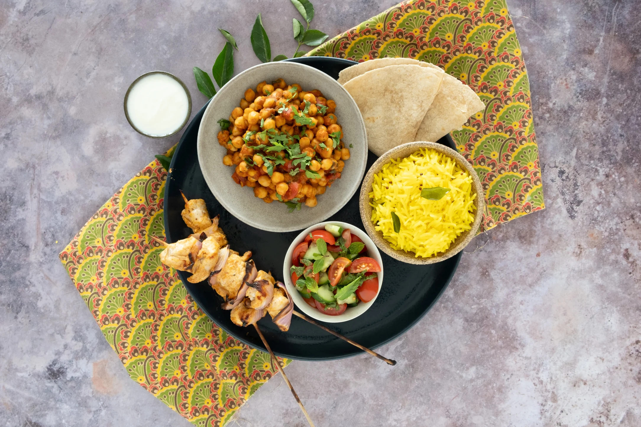 Indian Chicken Thali Plate: Tandoori Chicken and Chickpea Masala with Lime Rice, Mint Salad and Chapatis
