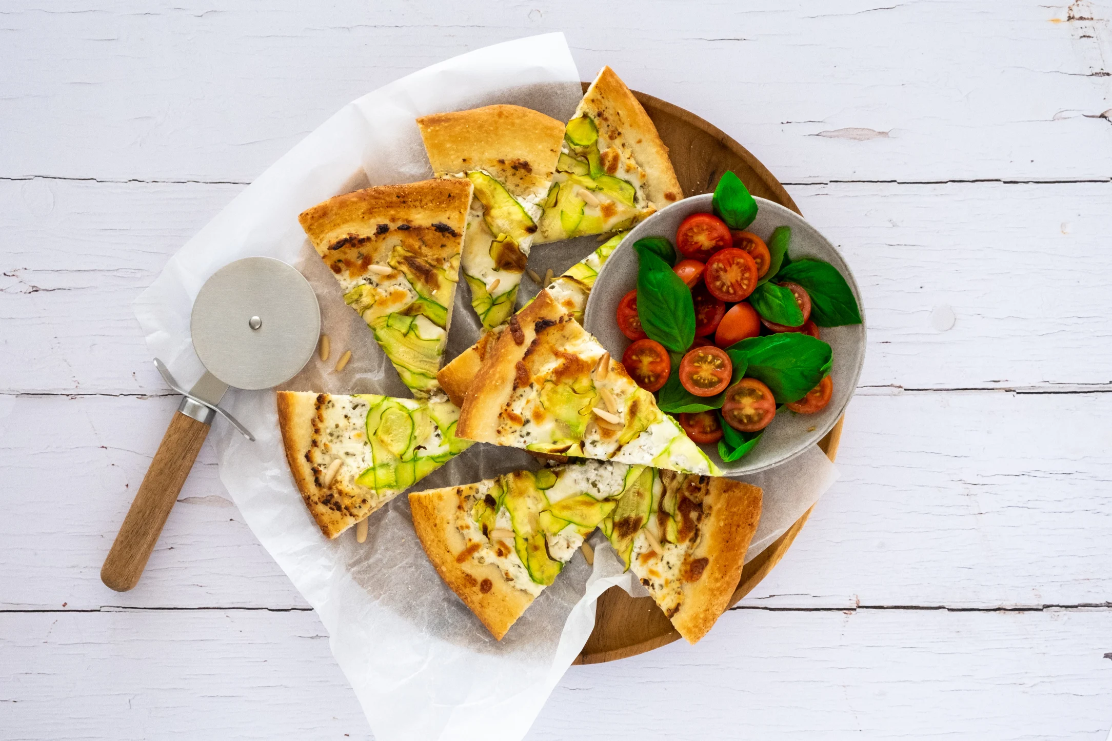 Ricotta and Zucchini Pizza with Pine Nuts and Tomato Salad