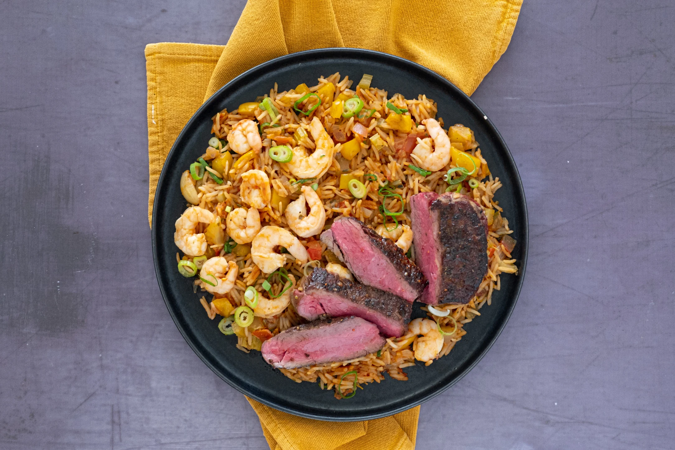 Tenderloin Fillet Steak and Prawn Jambalaya with Cajun Butter