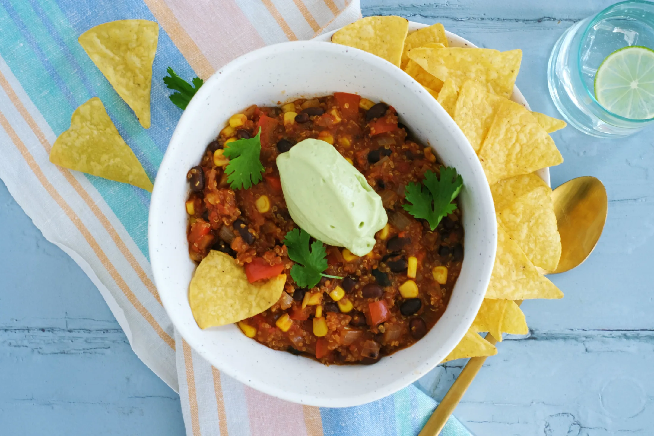 One-pot Black Bean and Quinoa Chilli with Avocado and Nachos