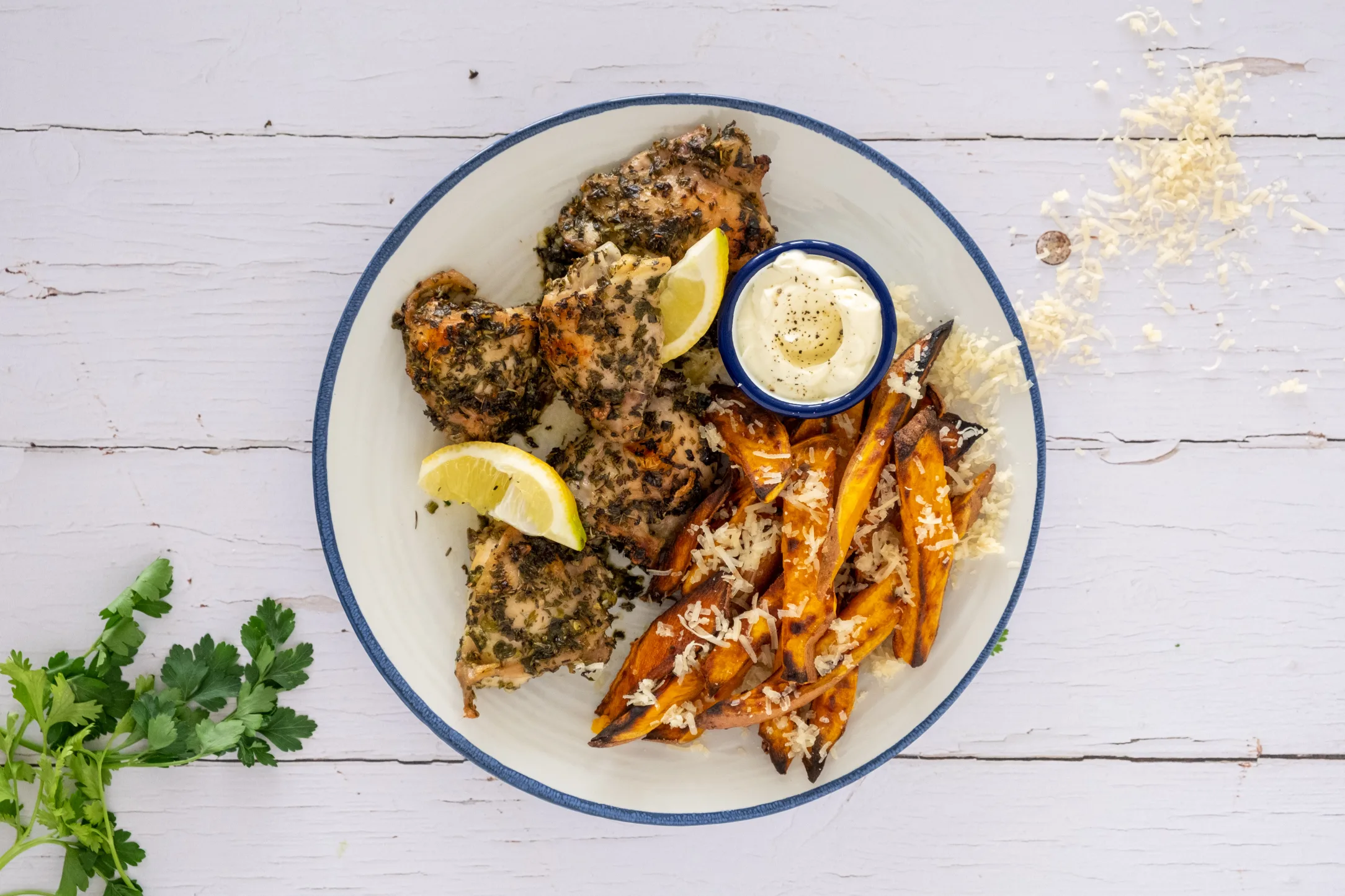 Herb Roasted Chicken Thighs with Parmesan Sweet Potato Fries and Sour Cream